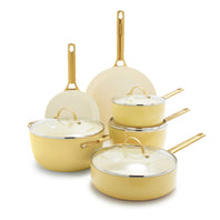 The GreenPan Reserve Ceramic Nonstick 10-Piece Cookware Set in the color Sunrise featuring gold-tone handles. 
