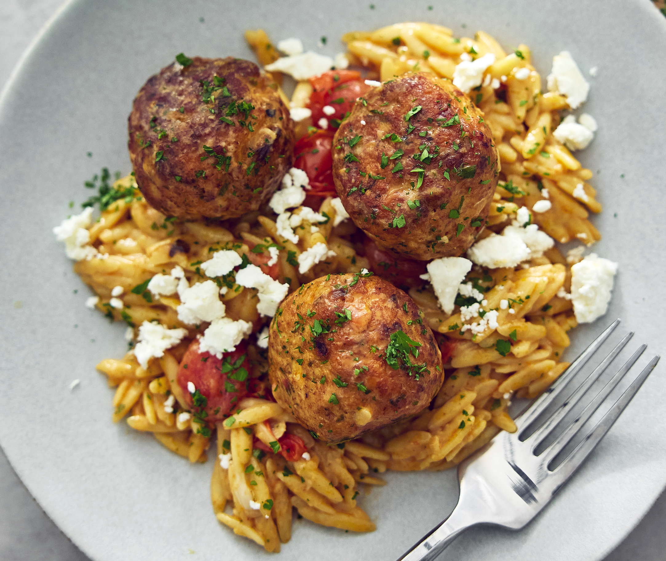 Greek Chicken Meatballs with Creamy Tomato Orzo