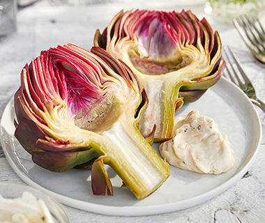 Steamed Artichokes with Herb Butter Sauce