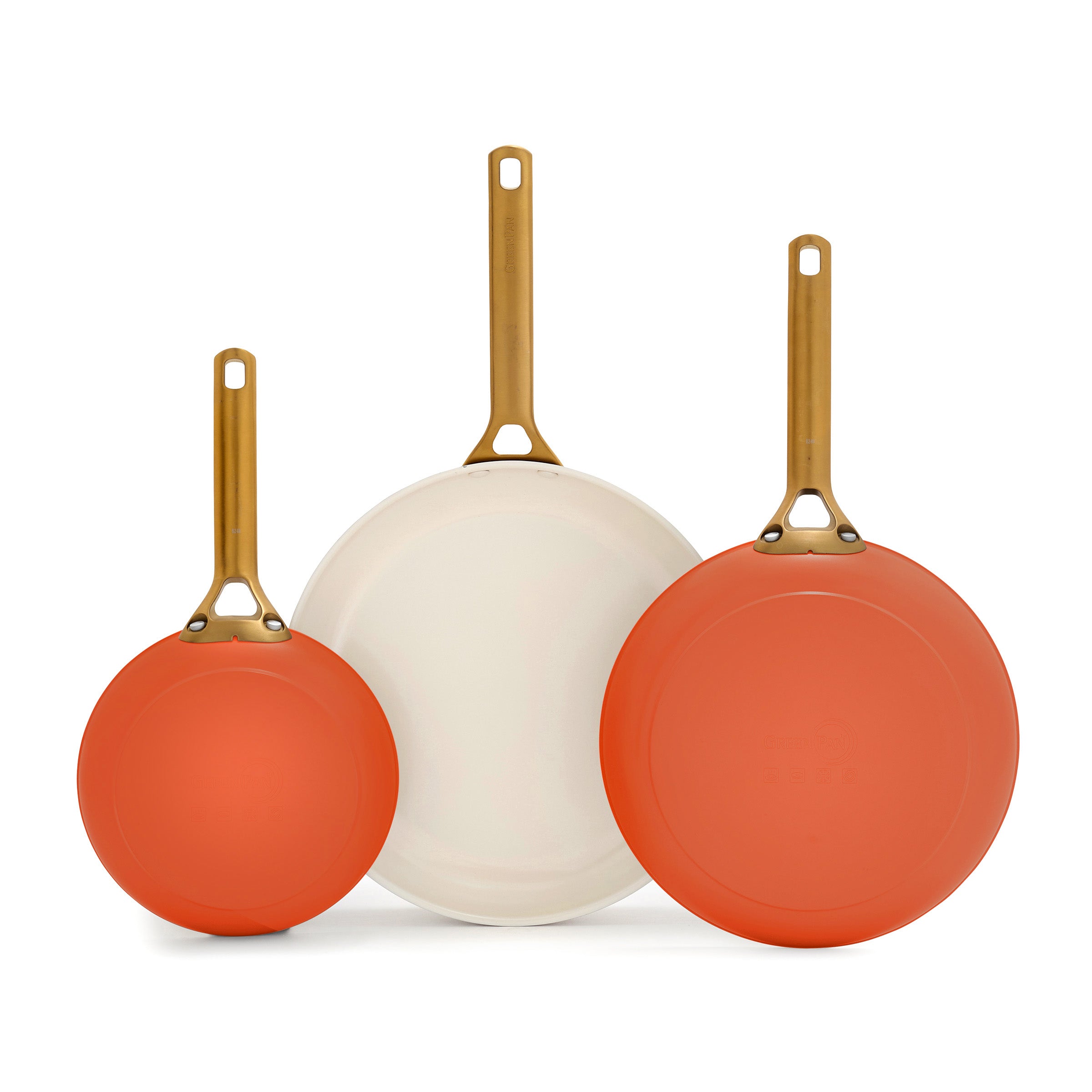 Three dark orange frying pans with gold handles on a white background.