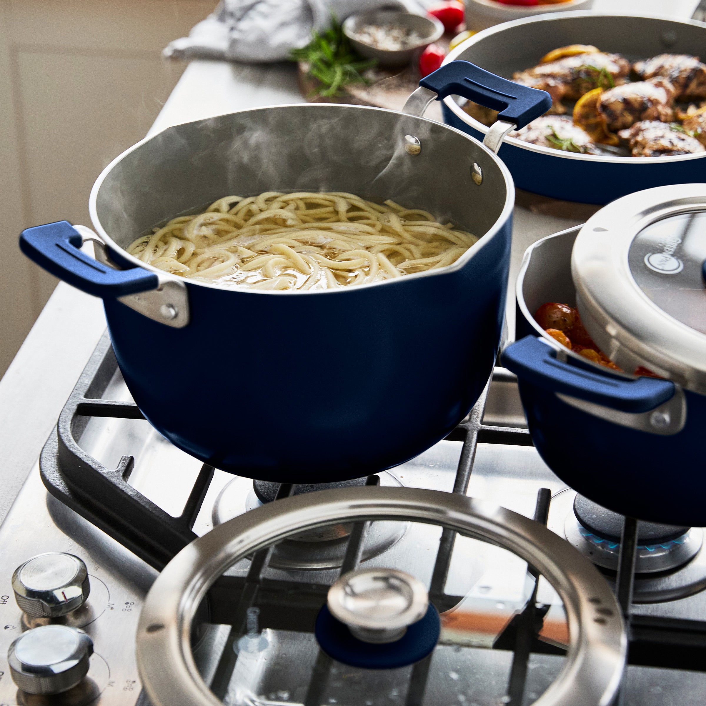 Dark blue cookware on a stovetop