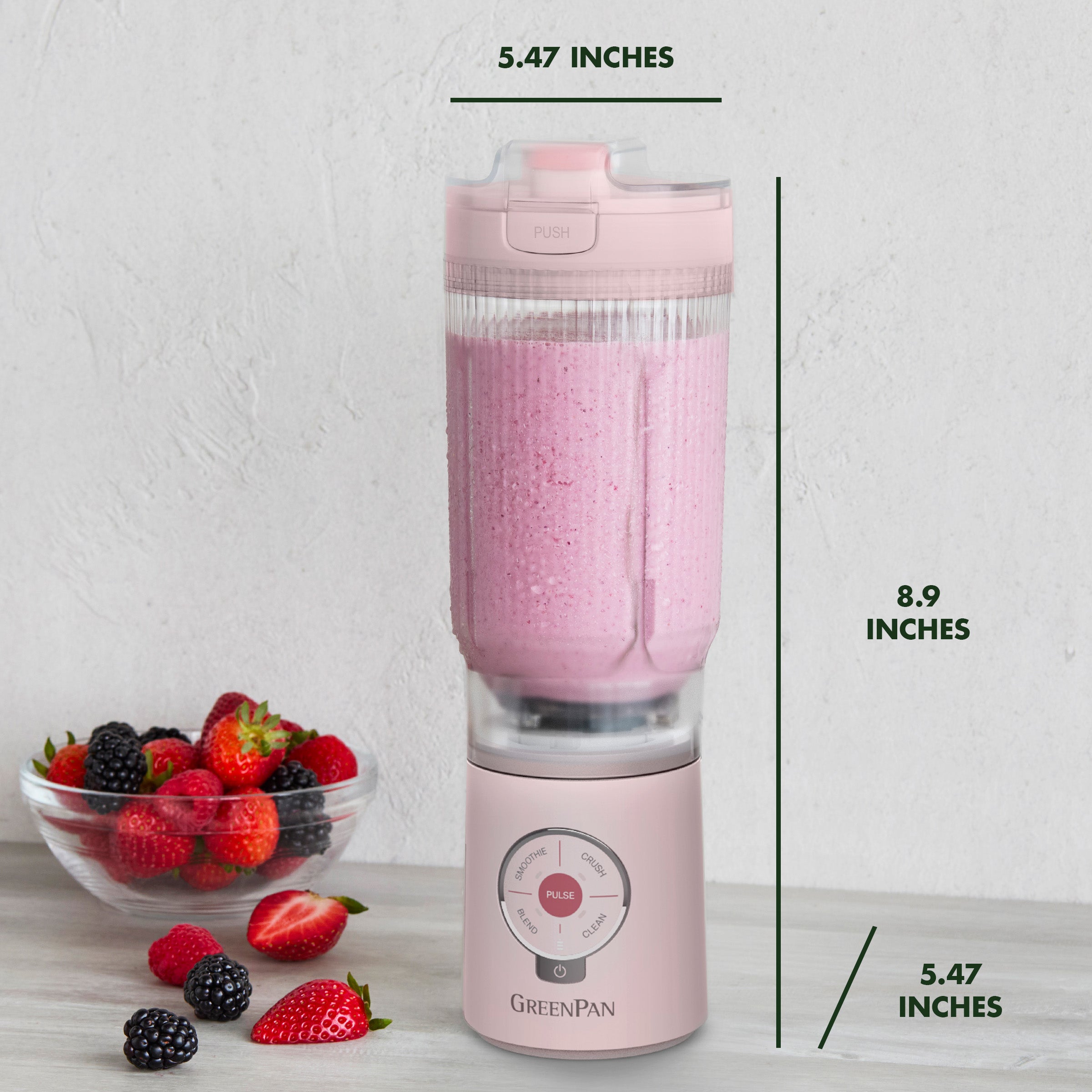 Pink portable blender with measurements on a white background