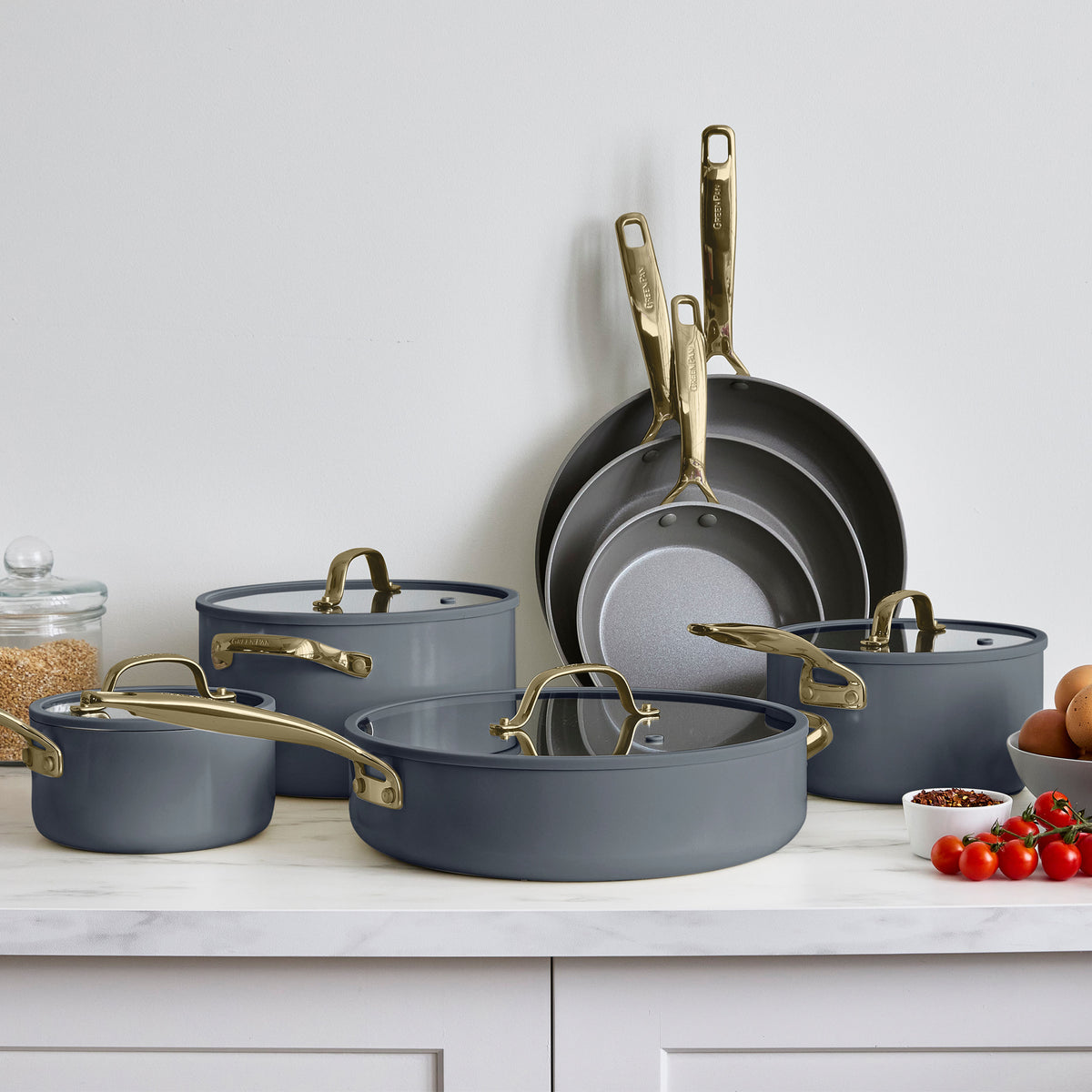 Slate gray ceramic nonstick cookware set with 11 pieces, including pots, pans, and lids, all induction-ready.