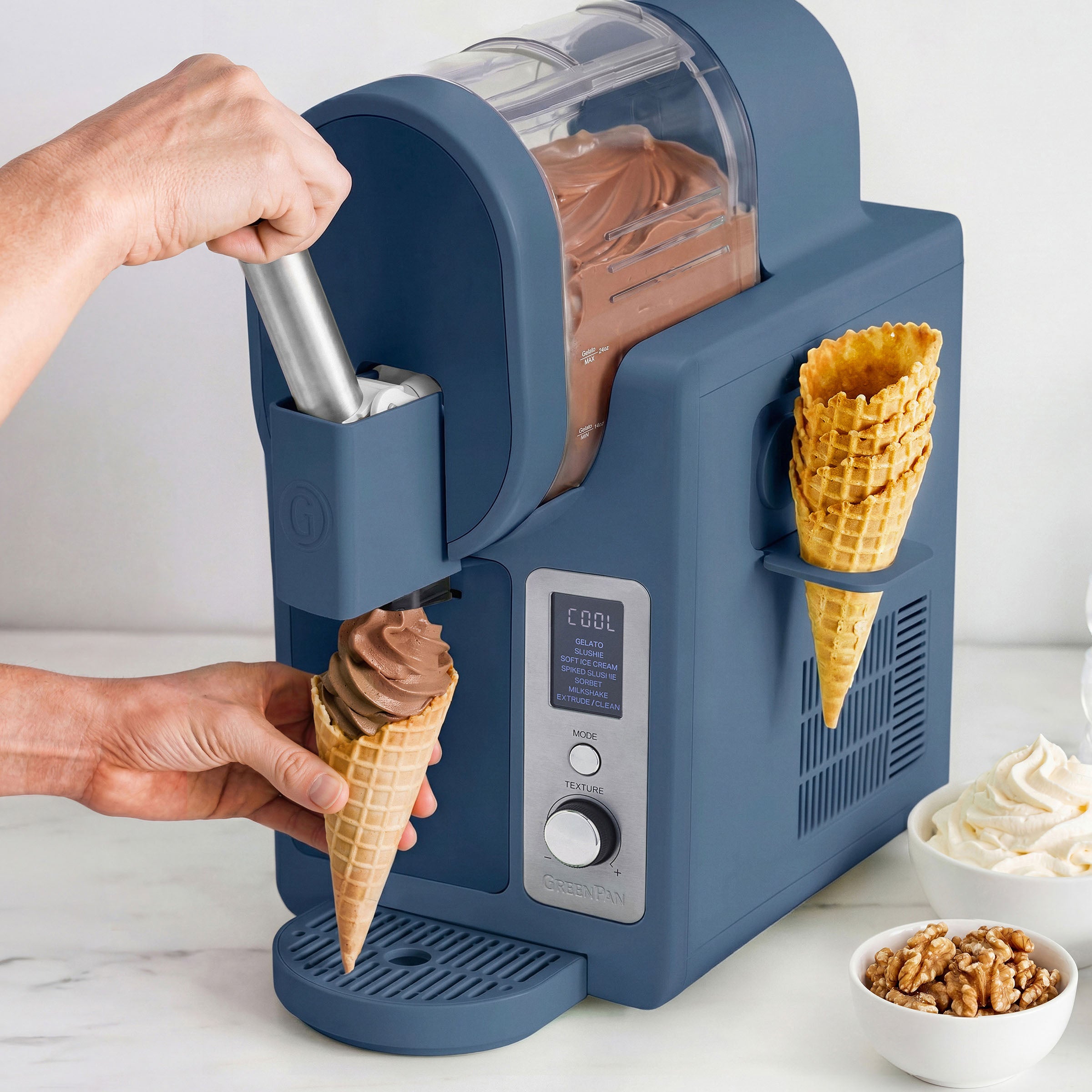 Ice cream maker dispensing chocolate ice cream into a cone