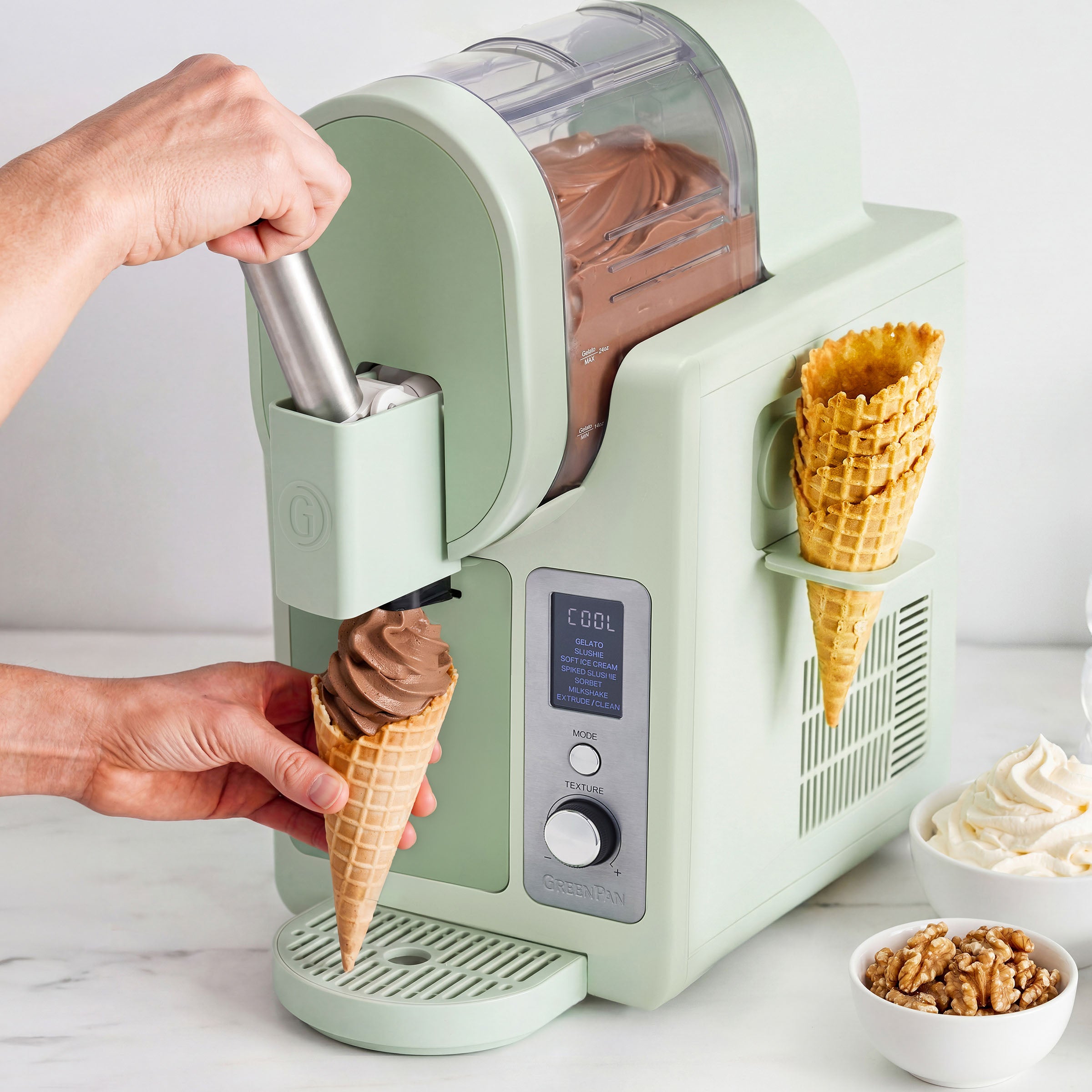 Ice cream maker dispensing chocolate ice cream into a cone