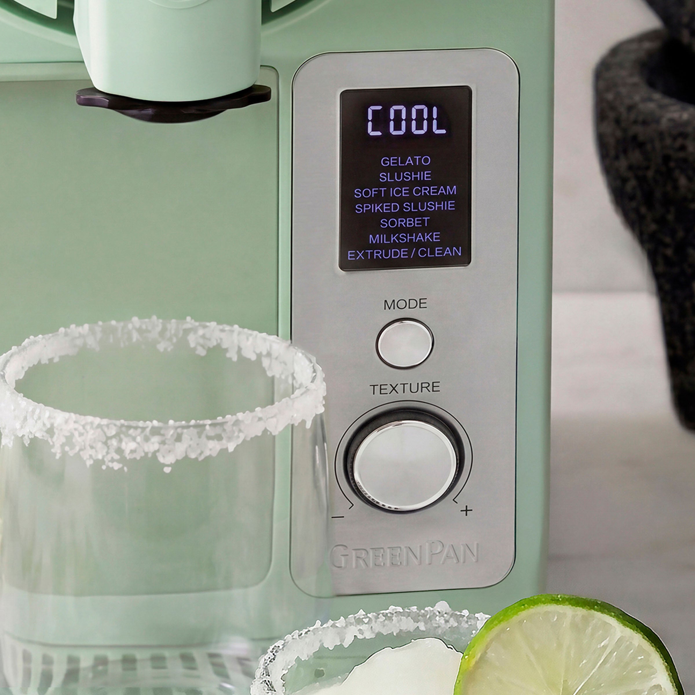 GreenPan ice cream maker with margarita glasses and lime slices on a kitchen counter