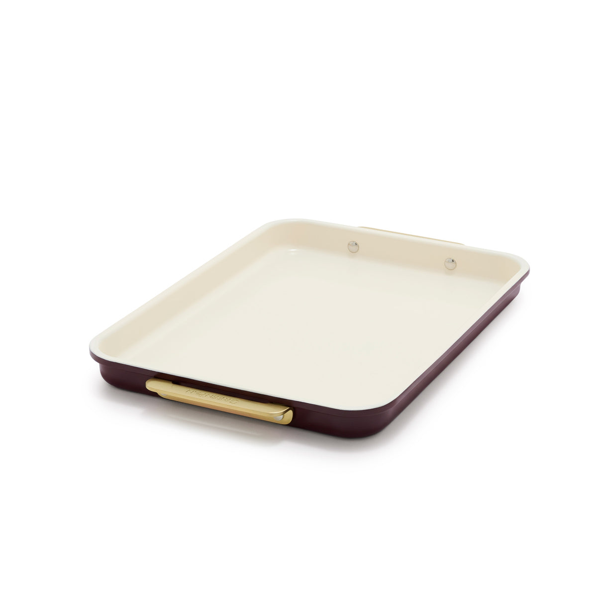 Reserve Bakeware 13″ x 9″ quarter sheet pan in Bordeaux red with a cream-colored nonstick interior and gold-toned handles.
