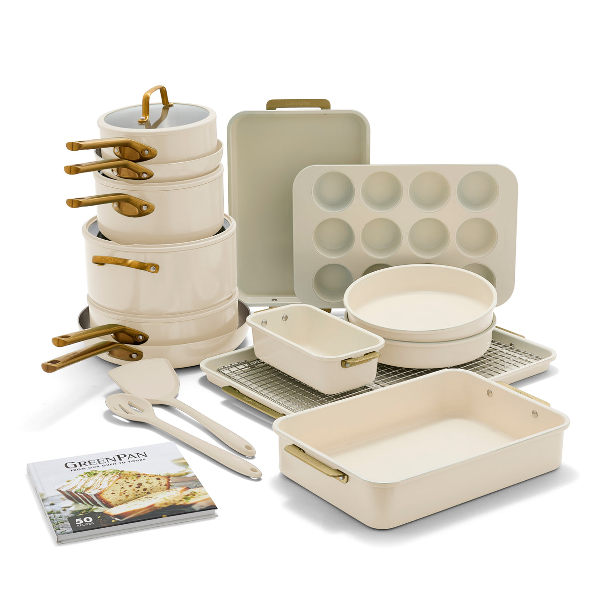 Collection of ceramic cookware with gold handles on a white background