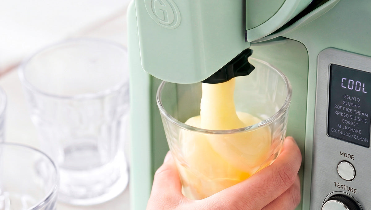 Pistachio Frost Pro dispensing a frozen treat into a glass.