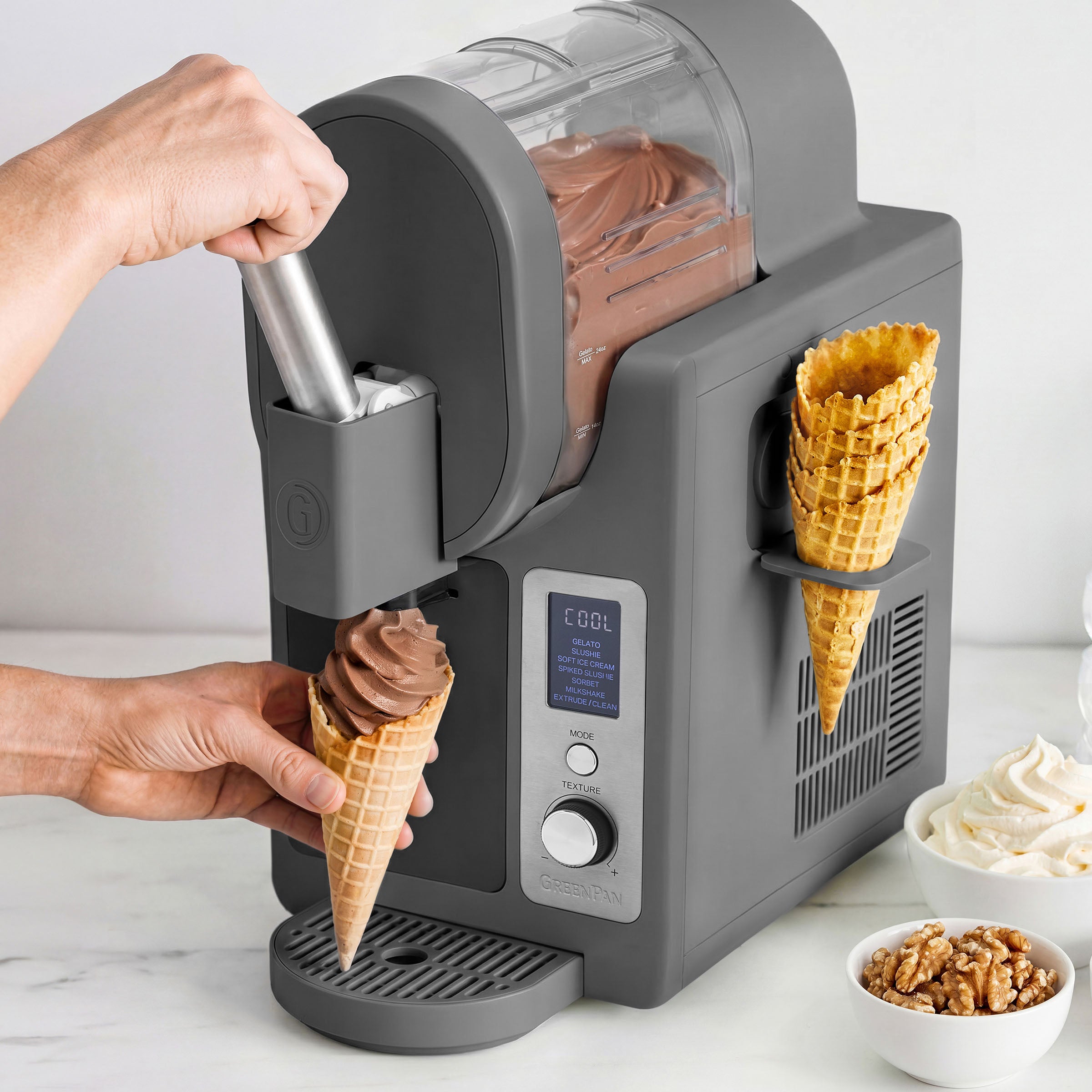 Ice cream maker dispensing chocolate ice cream into a cone