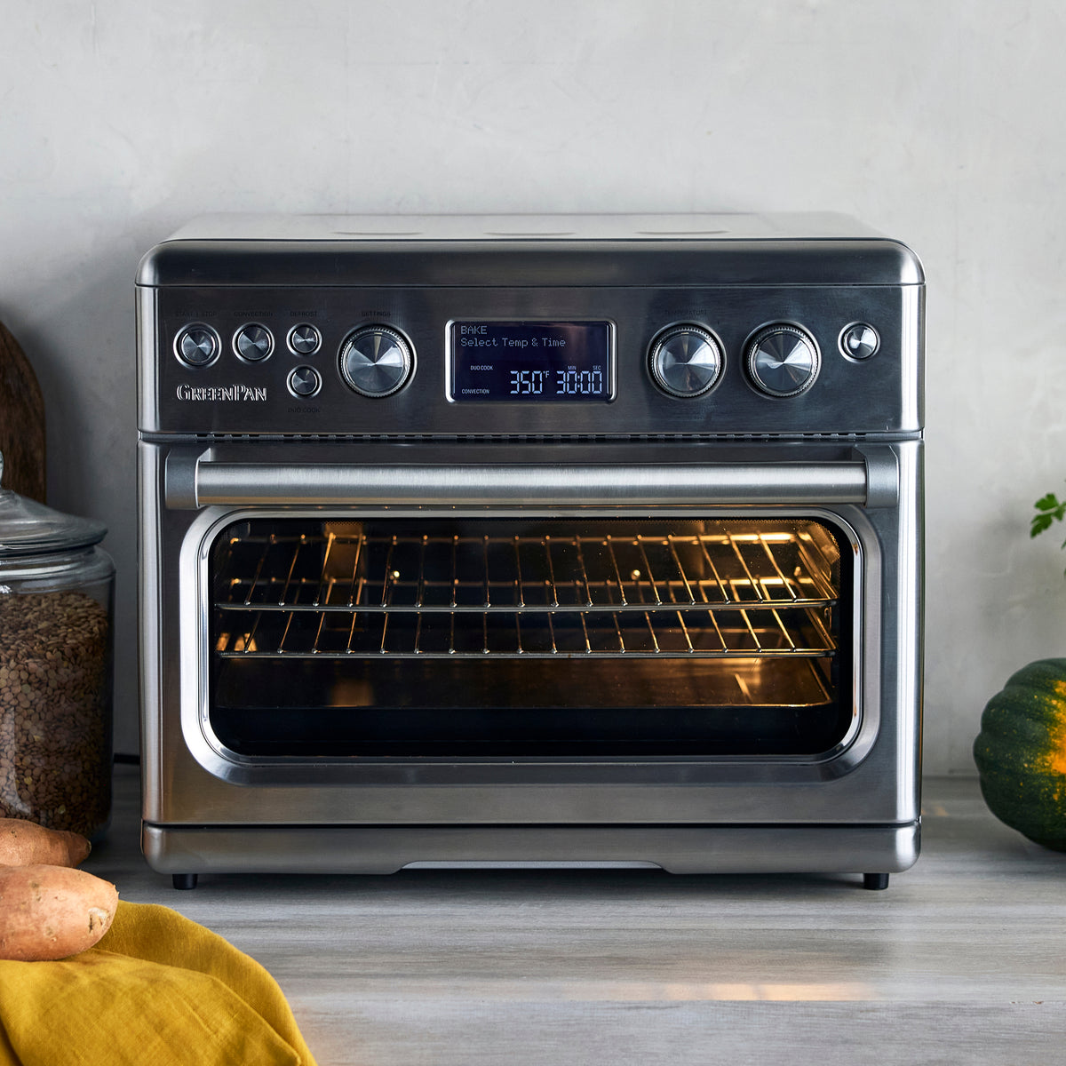Stainless steel convection air fryer toaster oven with digital display showing 350°F and 30:00.
