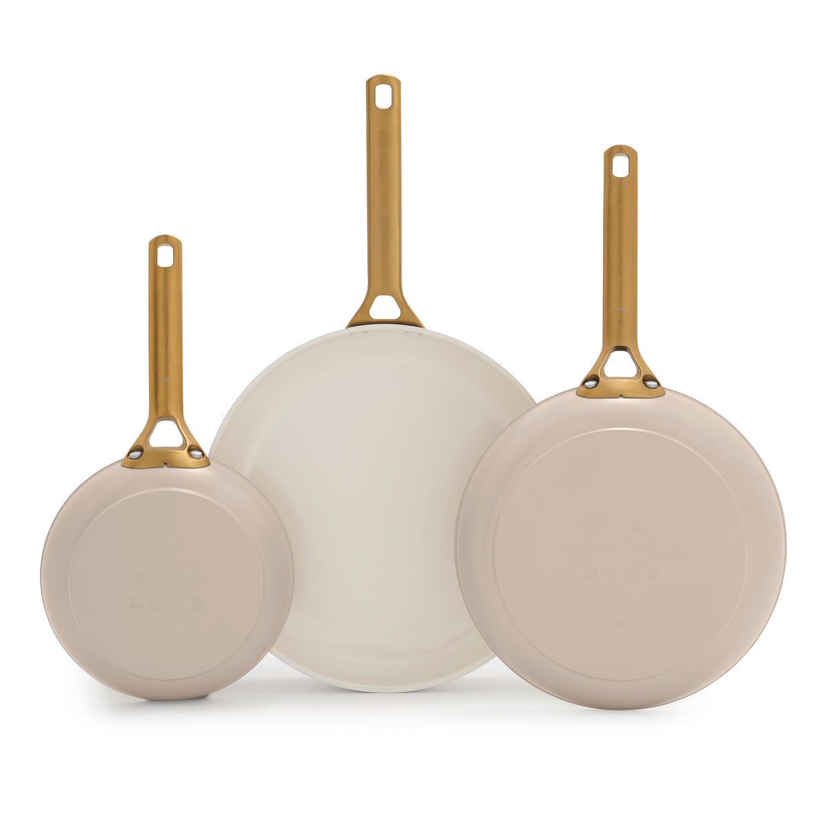 Set of three taupe frying pans with gold handles on a white background