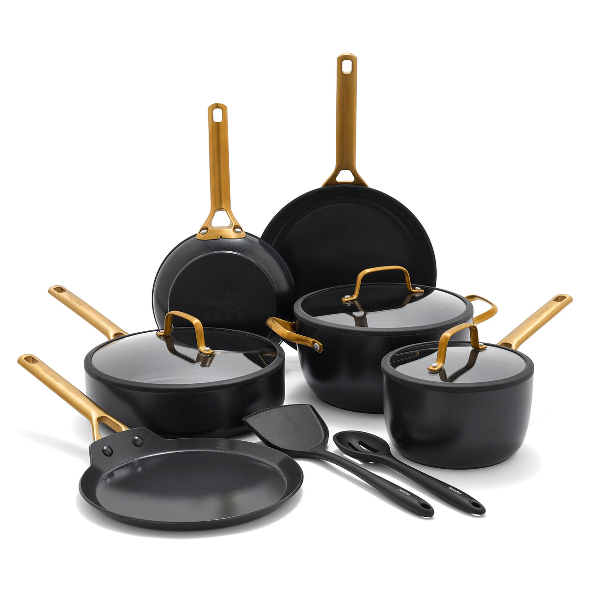 Set of black cookware with gold handles on a white background