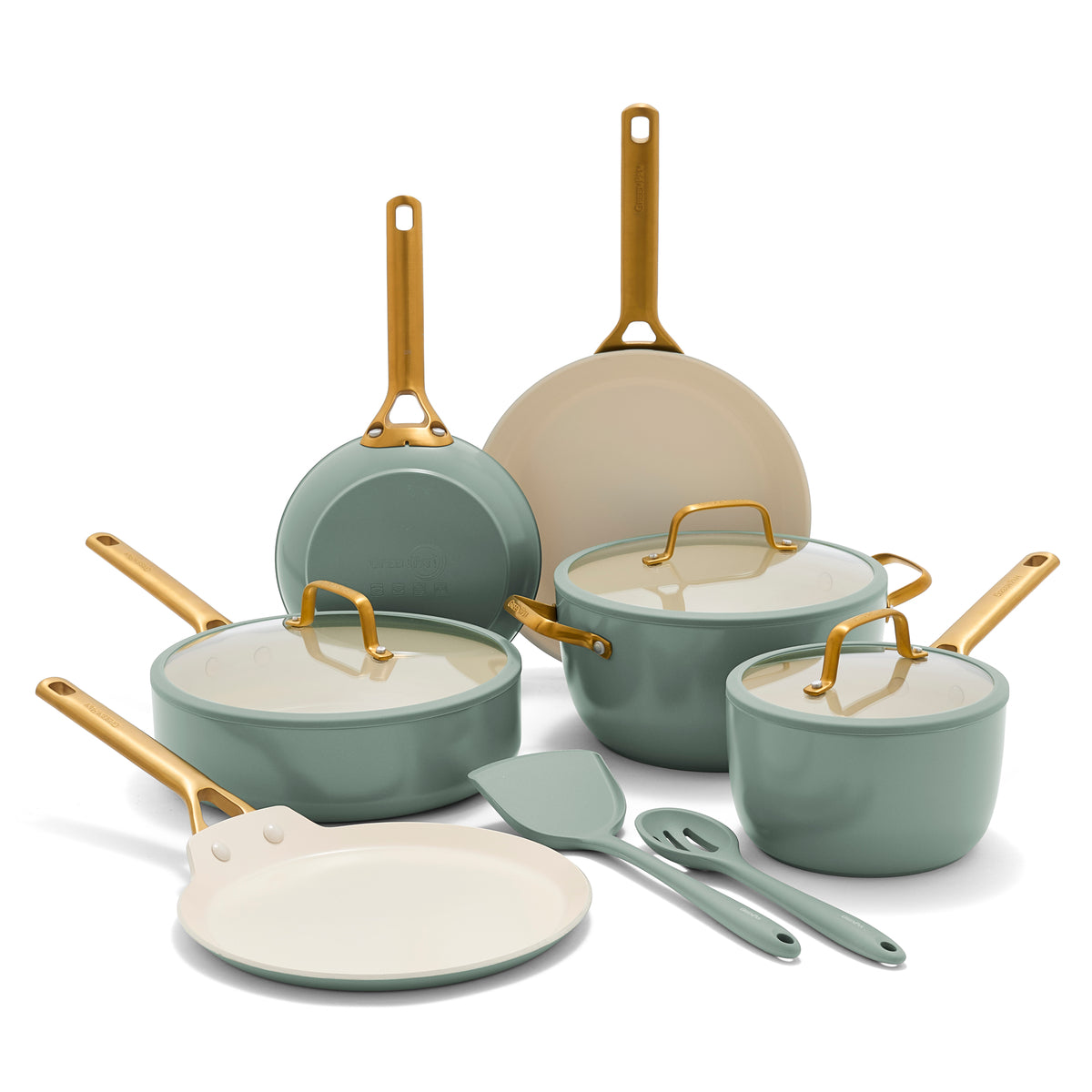 Set of green cookware with gold handles on a white background