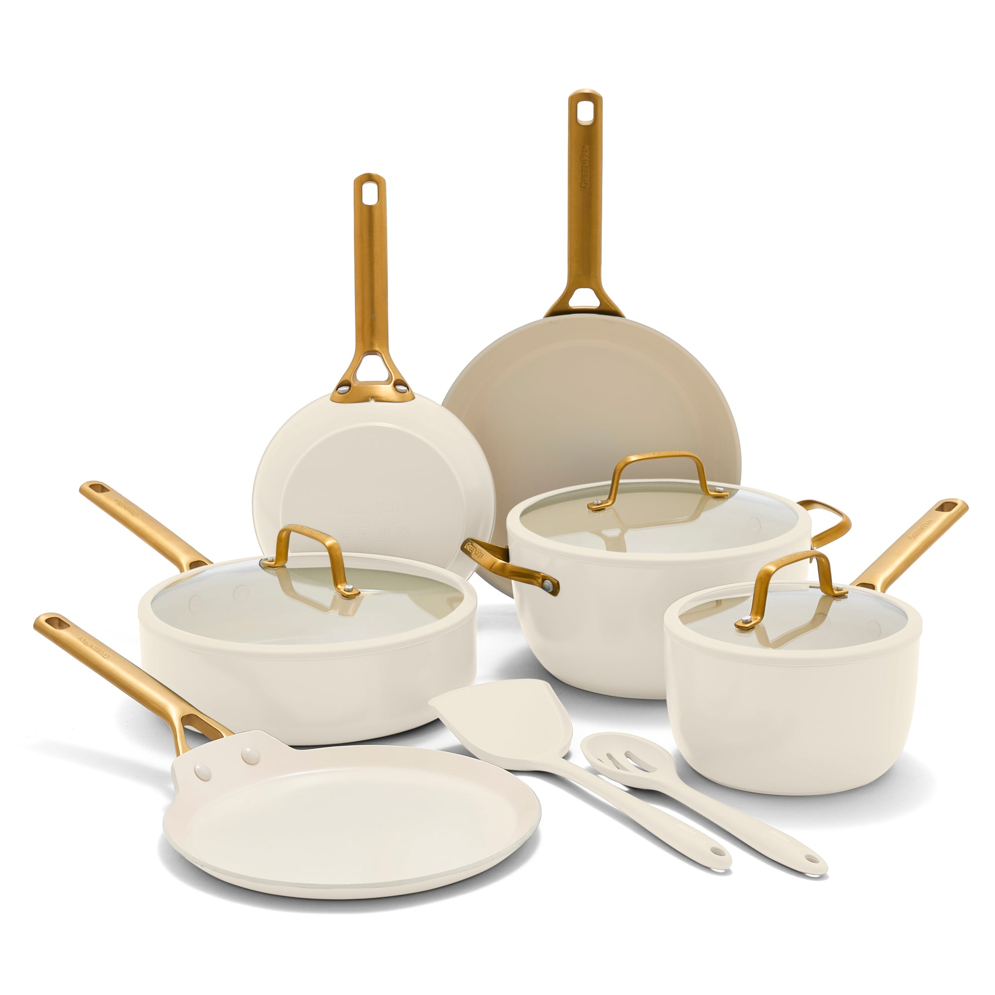 Set of white cookware with gold handles on a white background