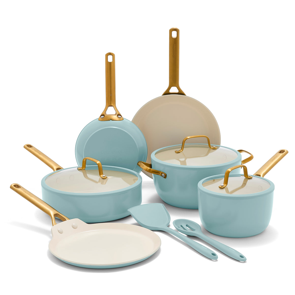 Set of light blue cookware with gold handles on a white background