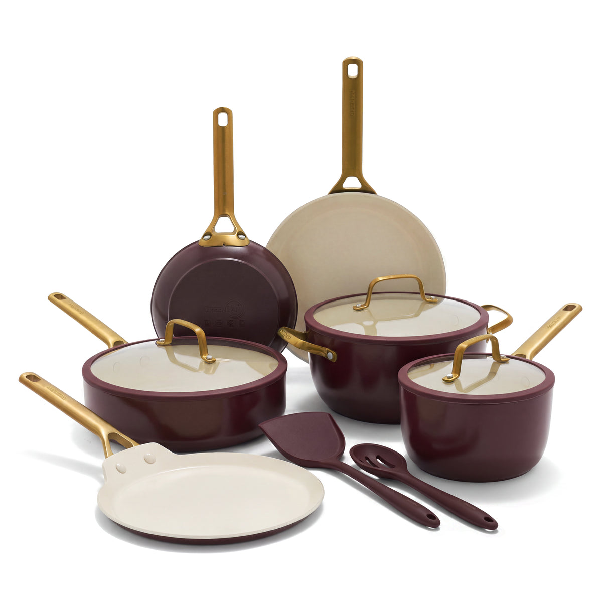 11-piece Bordeaux ceramic cookware set with gold handles, including pots, pans, and utensils on a white background.