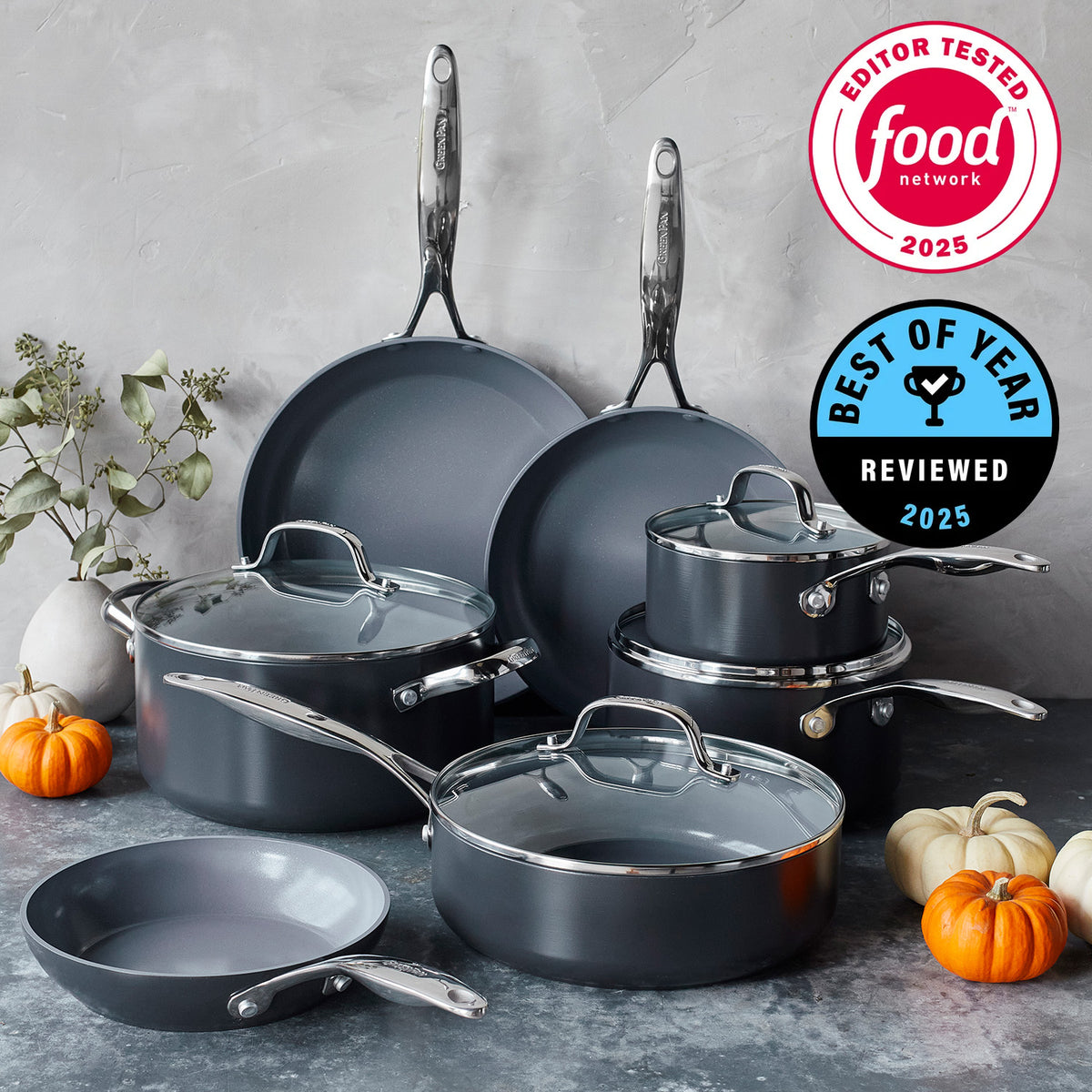 Gray ceramic nonstick 11-piece cookware set on a counter with pumpkins and Food Network awards in the background.