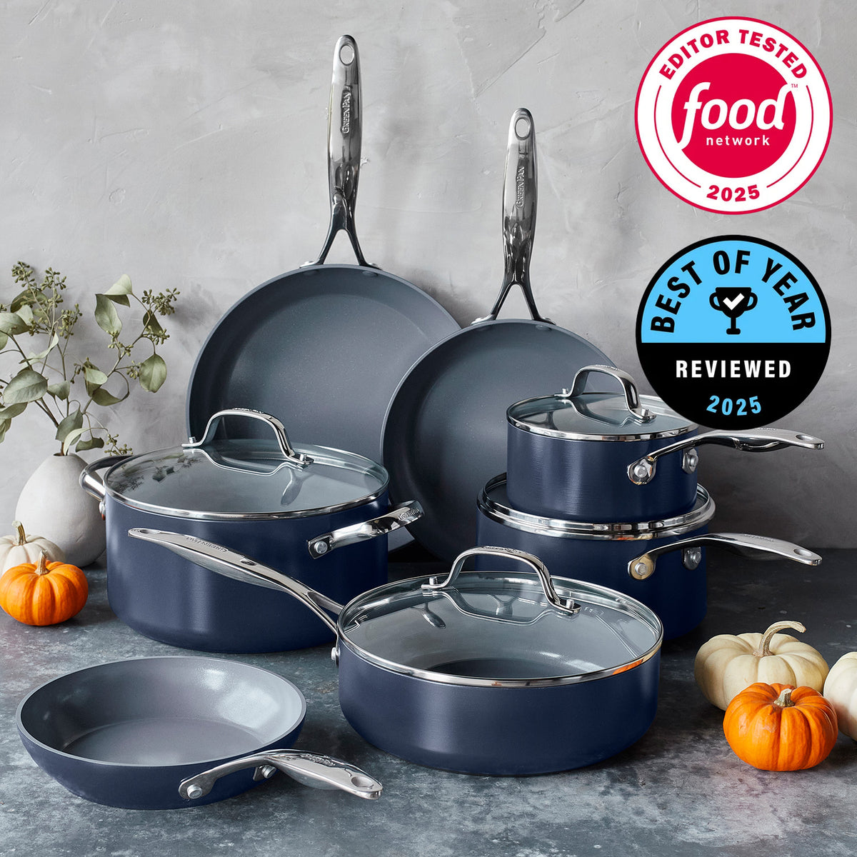 Twilight blue ceramic nonstick cookware set with lids, pumpkins, and Food Network  Best of Year 2025 seals visible.