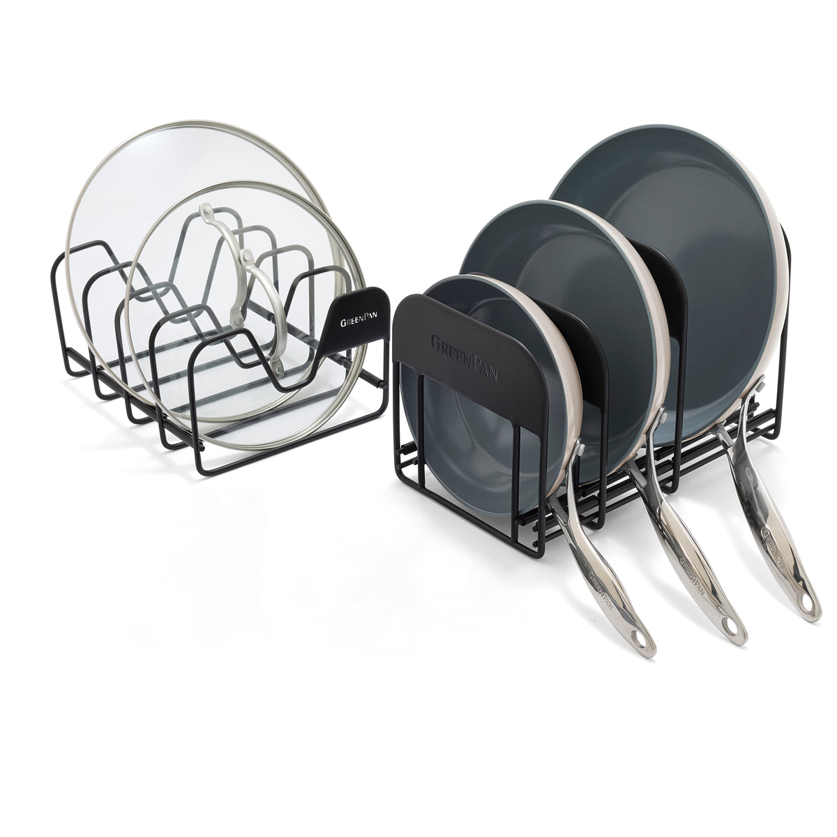 Two black racks hold glass lids and taupe frypans from the Valencia Pro Starter Set, all stored upright.