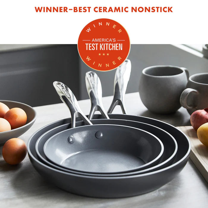 Set of frypans with 'America's Test Kitchen Winner' label on a kitchen counter.
