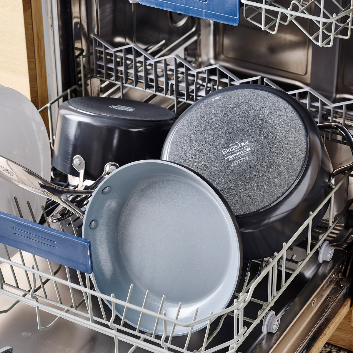 Dishwasher loaded with gray Valencia Pro and Premiere Ovenware 24-piece set, along with pots and pans.