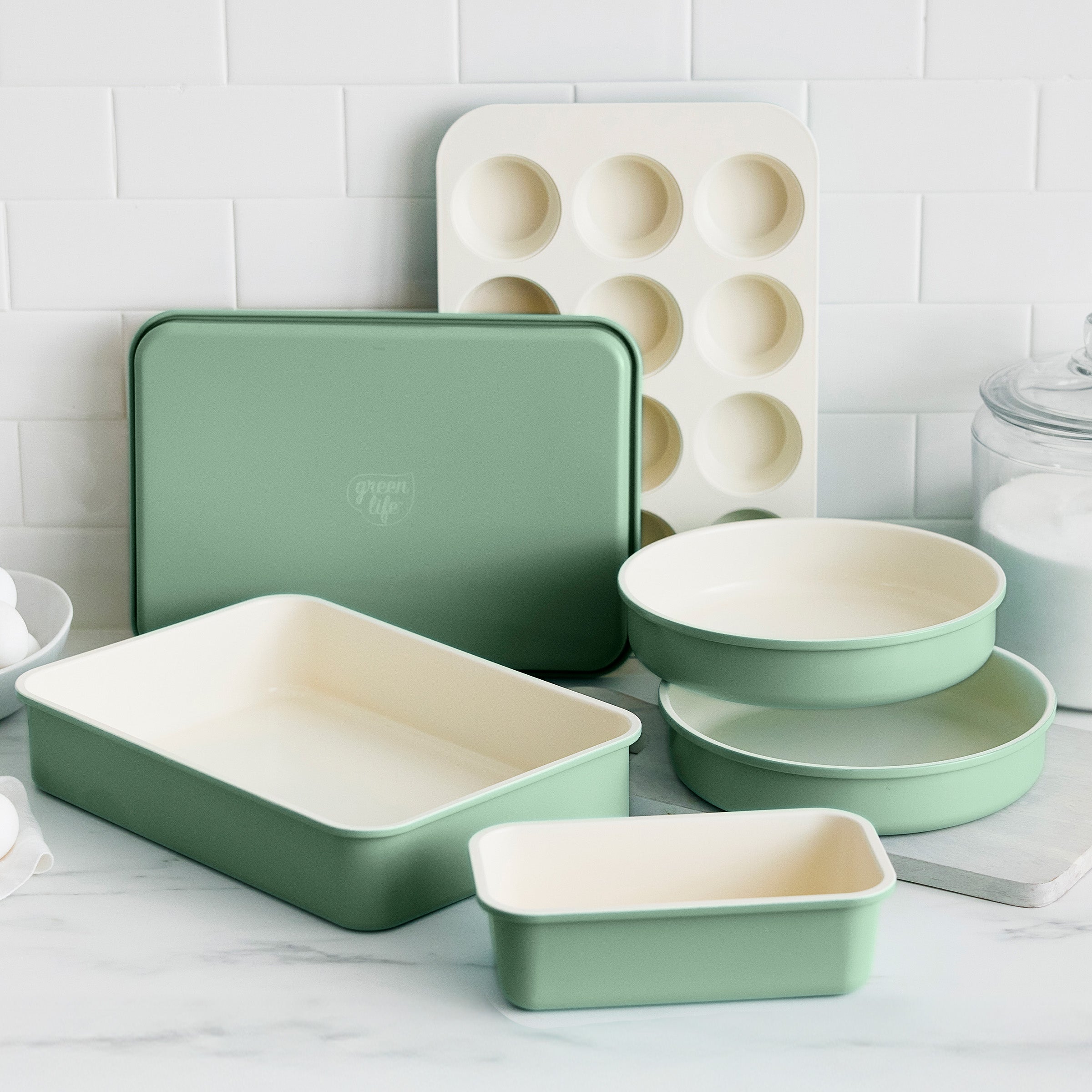 Set of green bakeware on a kitchen counter