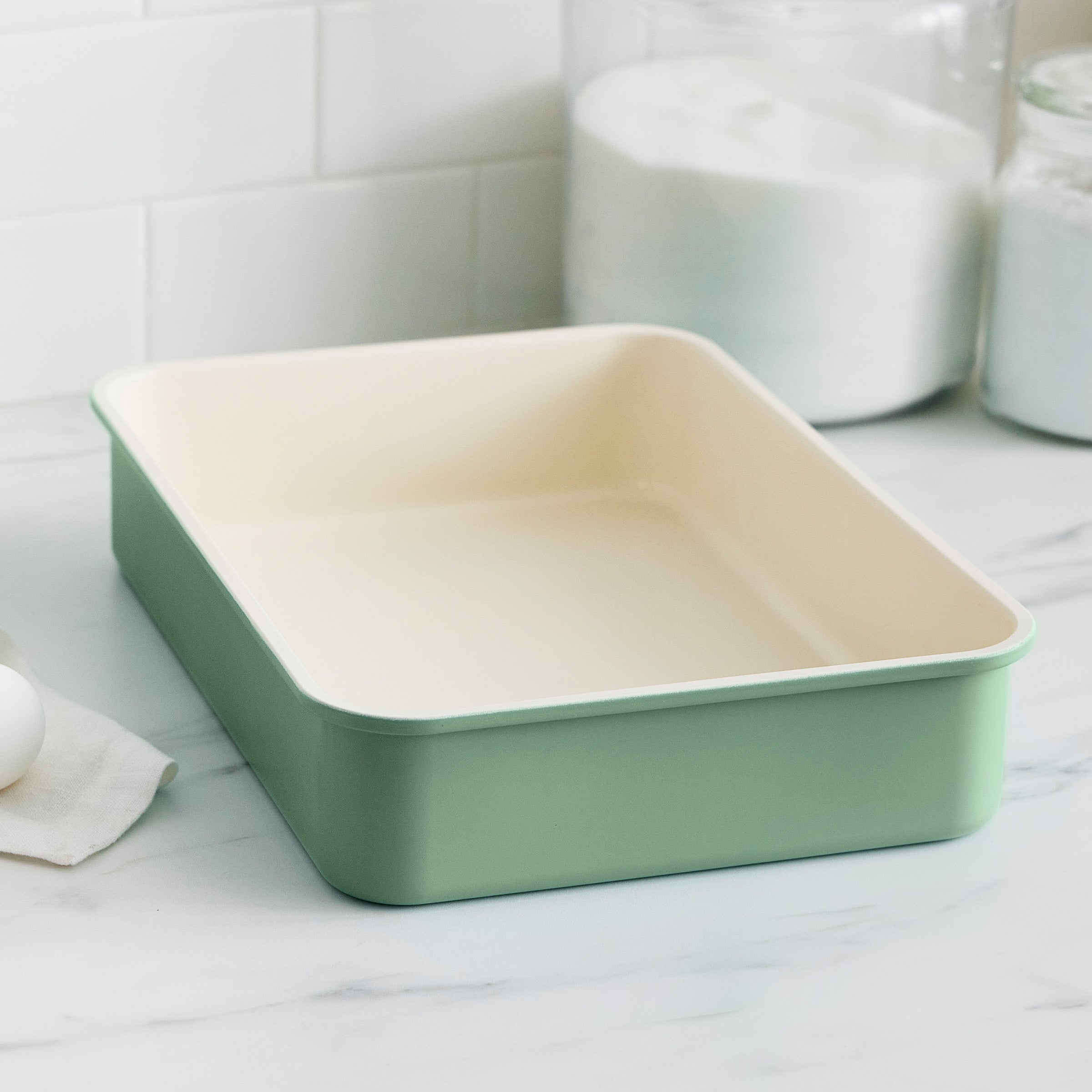 Green cake pan on a kitchen counter