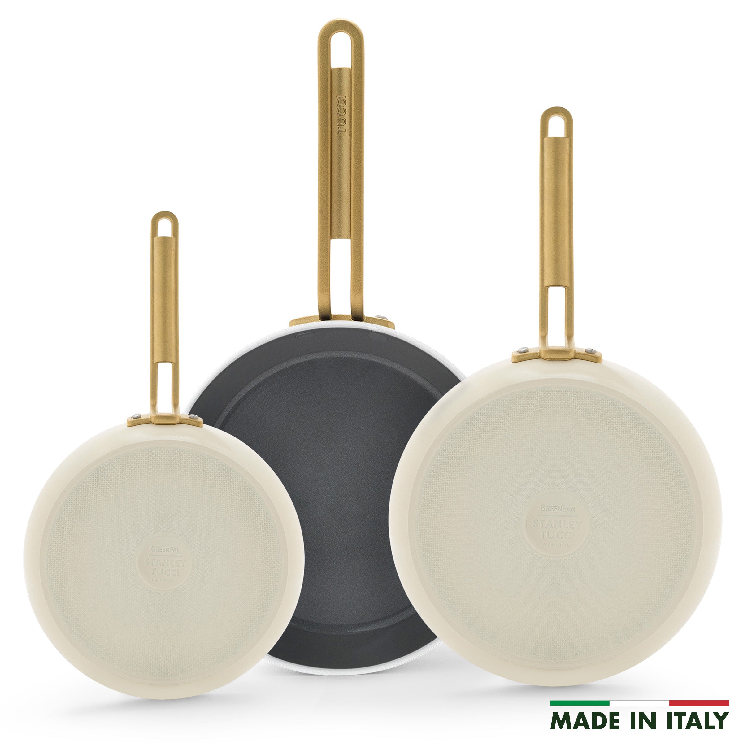 Three white frying pans with gold handles on a white background