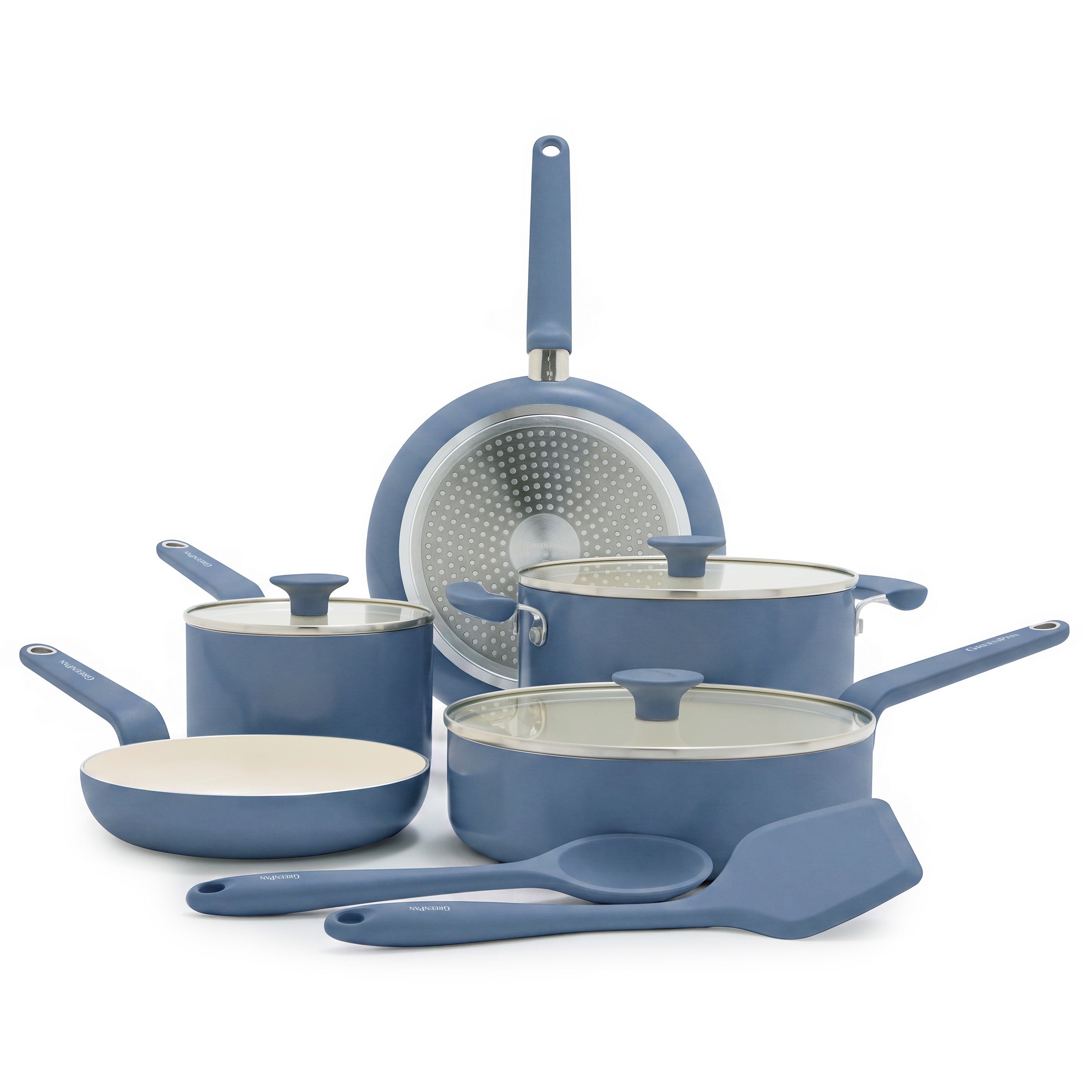 10-piece Dutch Blue ceramic cookware set with pots, pans, glass lids, and utensils arranged on a white background.