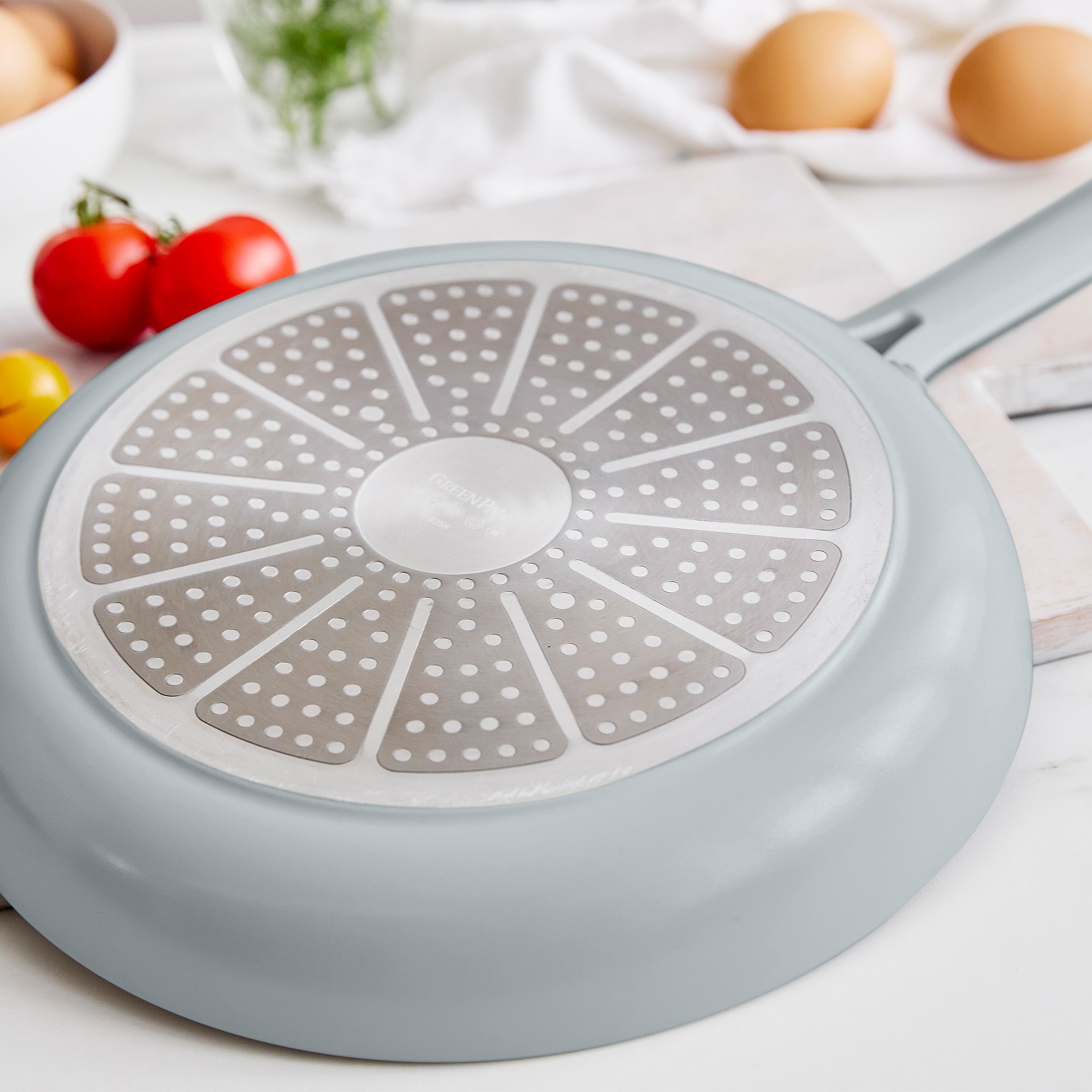 Light blue frying pan on a white background