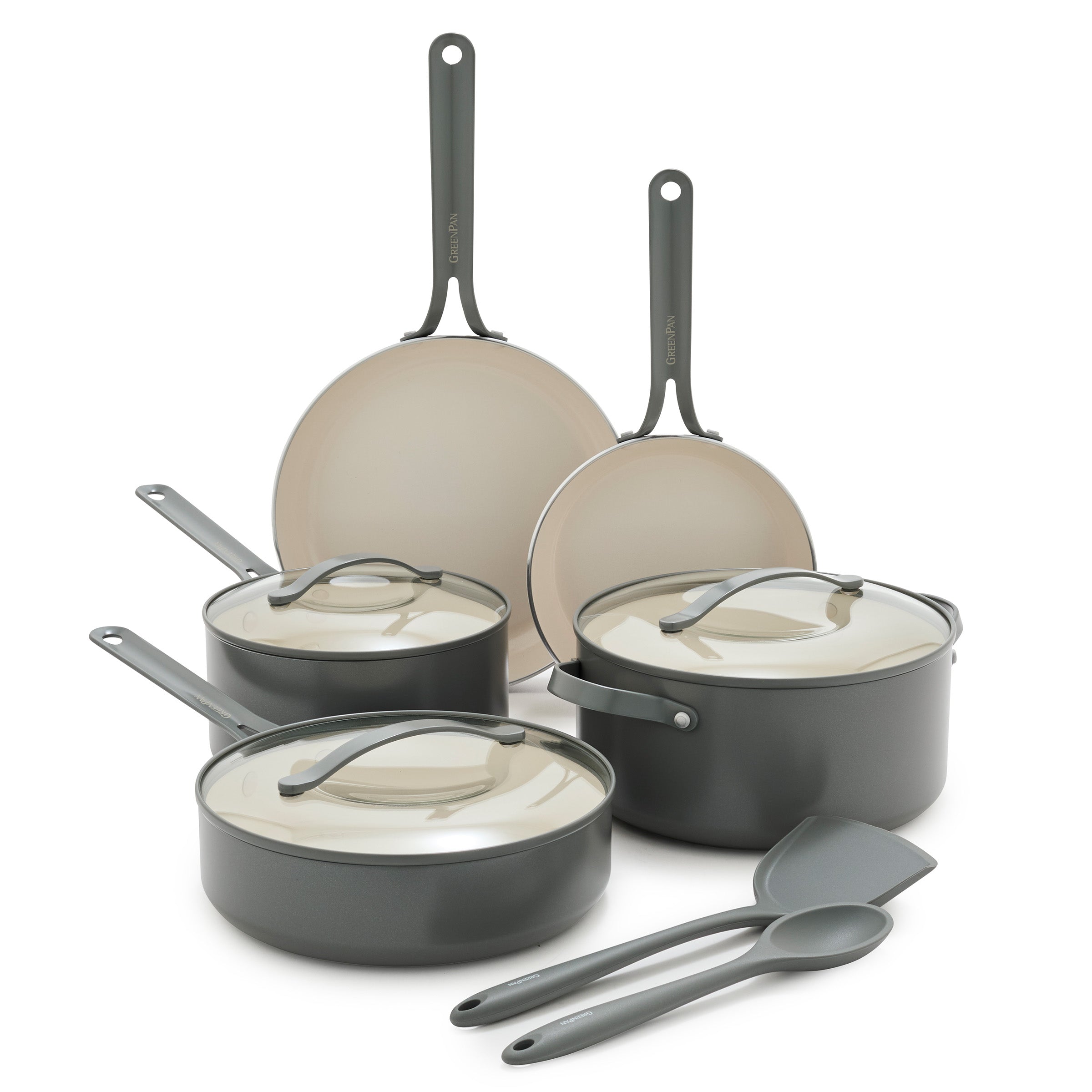 Set of cookware including pots, pans, and utensils on a white background