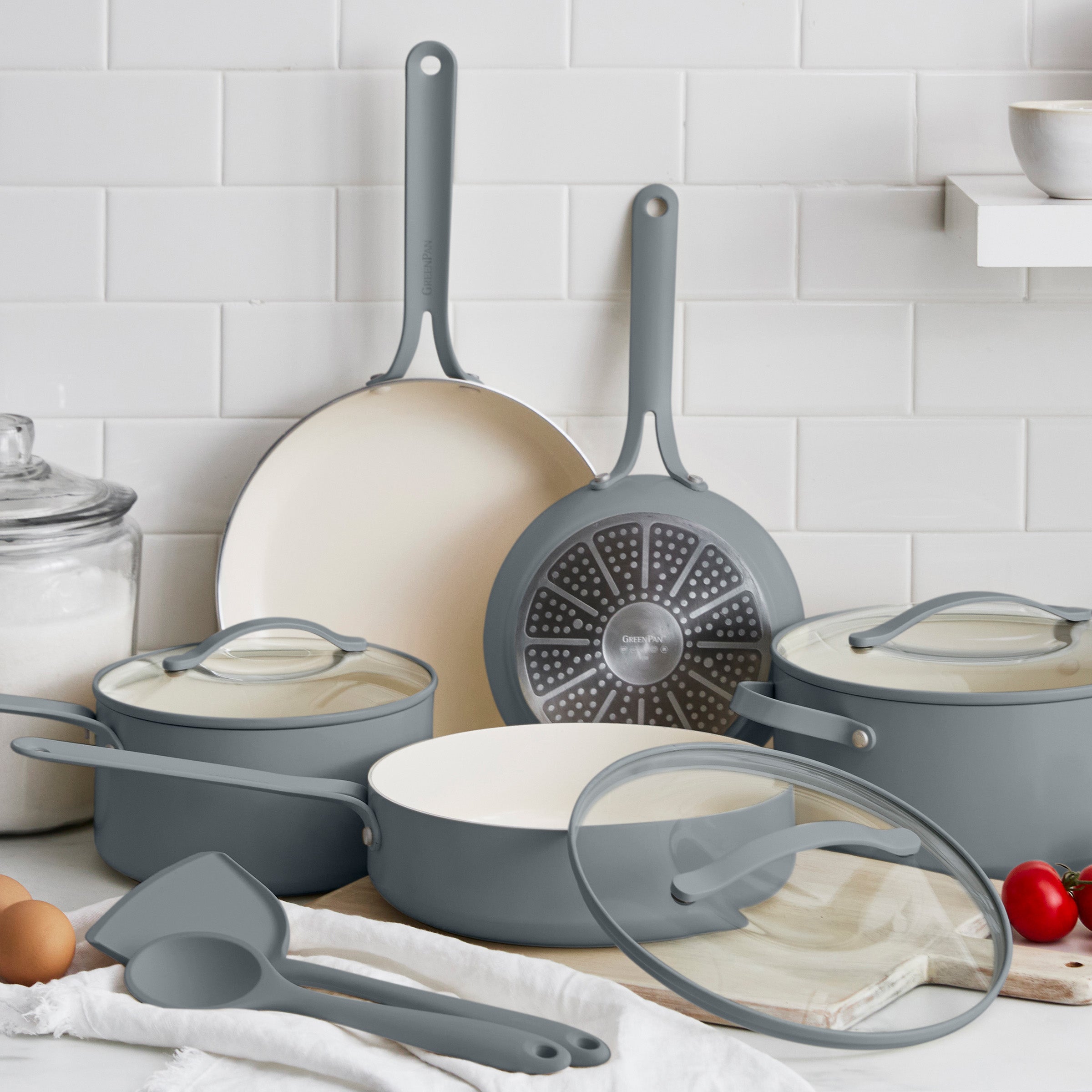 Set of gray cookware on a kitchen counter.