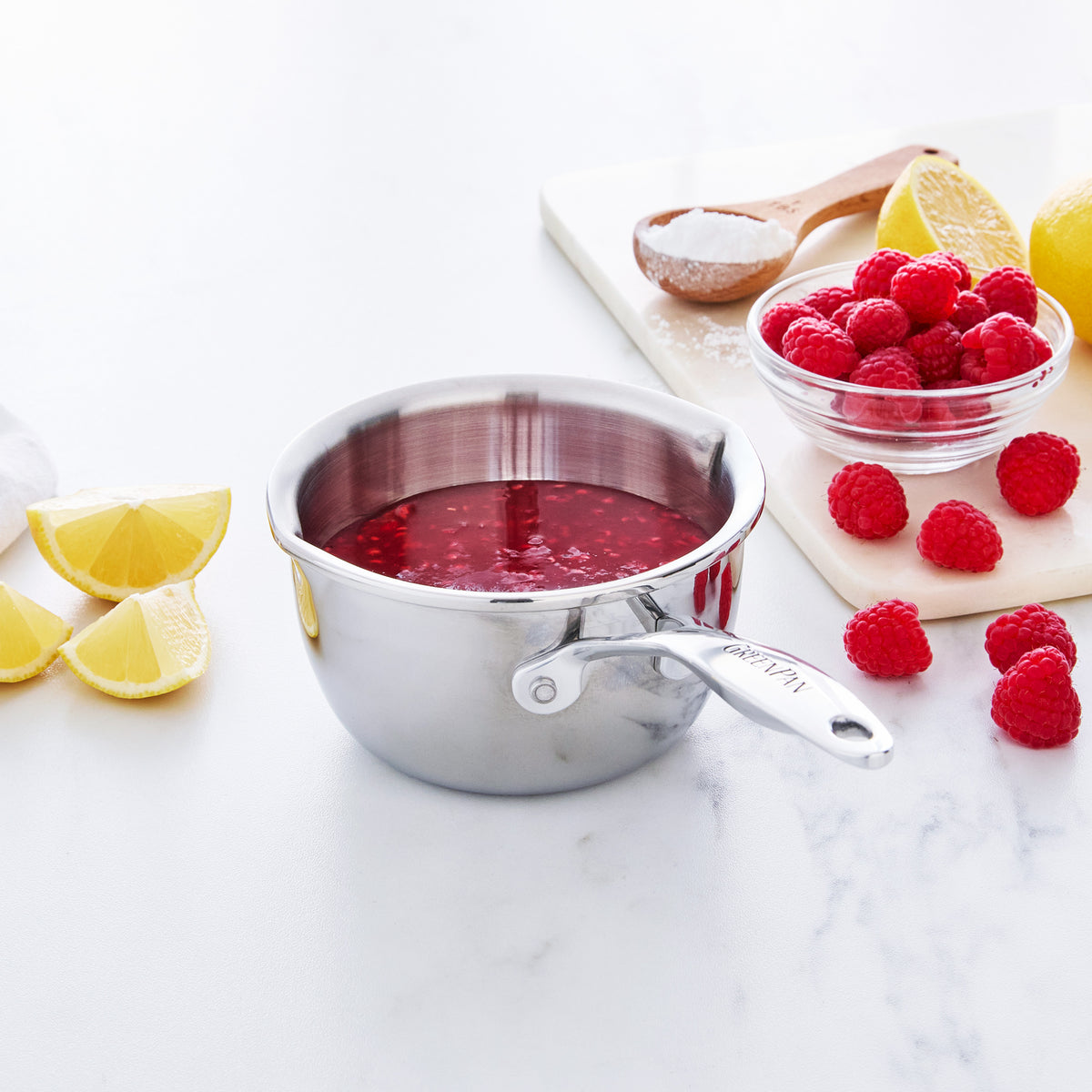 Stainless steel butter warmer filled with berry compote