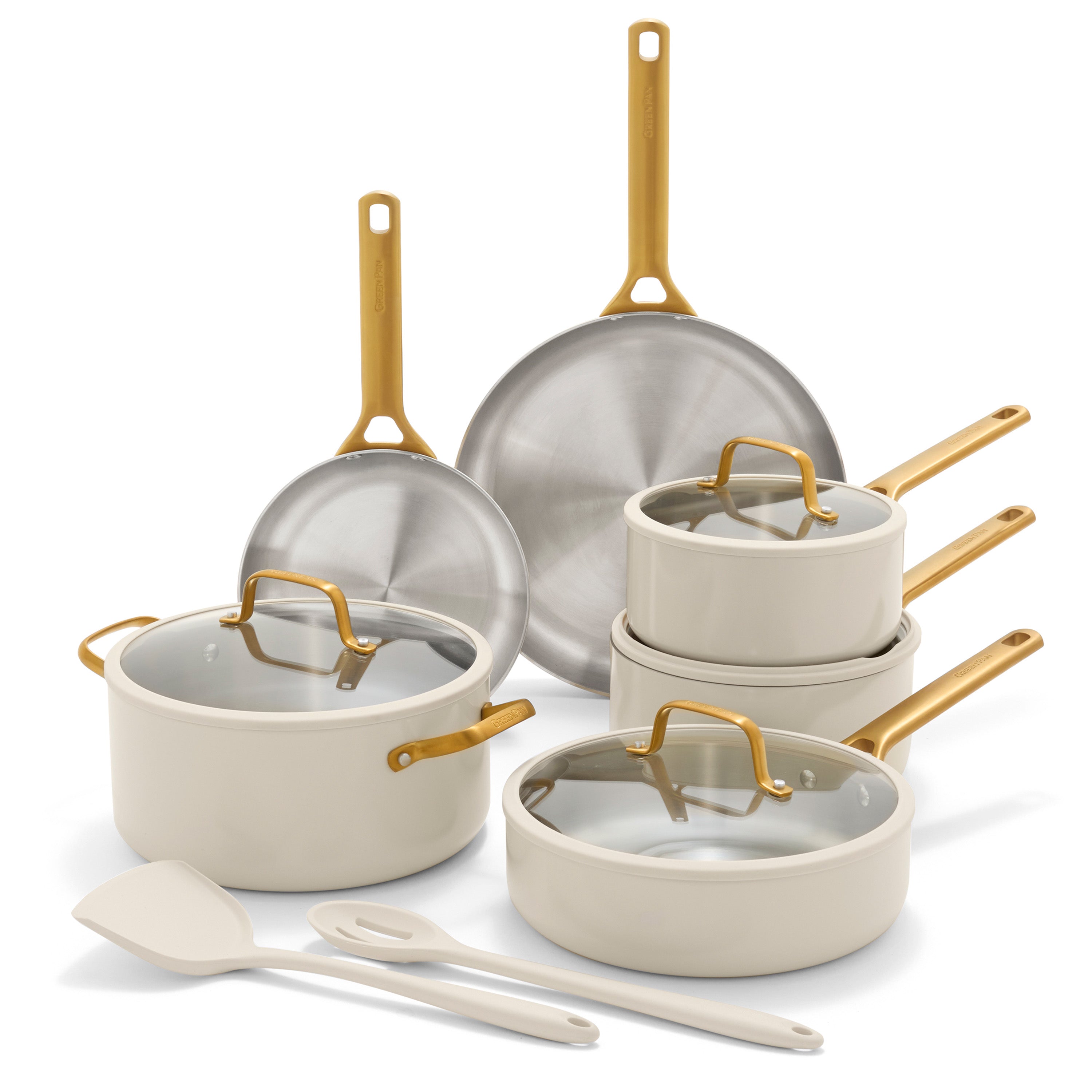 Set of cookware with gold handles on a white background
