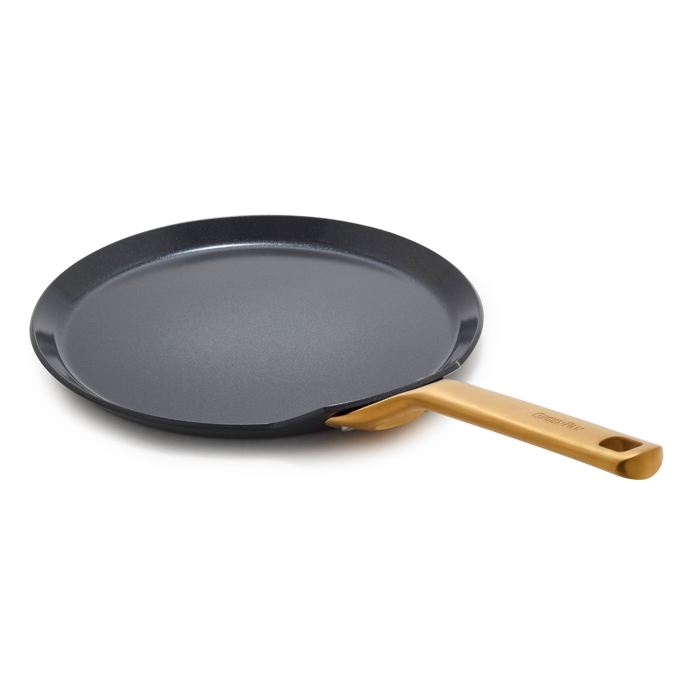 Black crepe pan with a gold handle on a white background