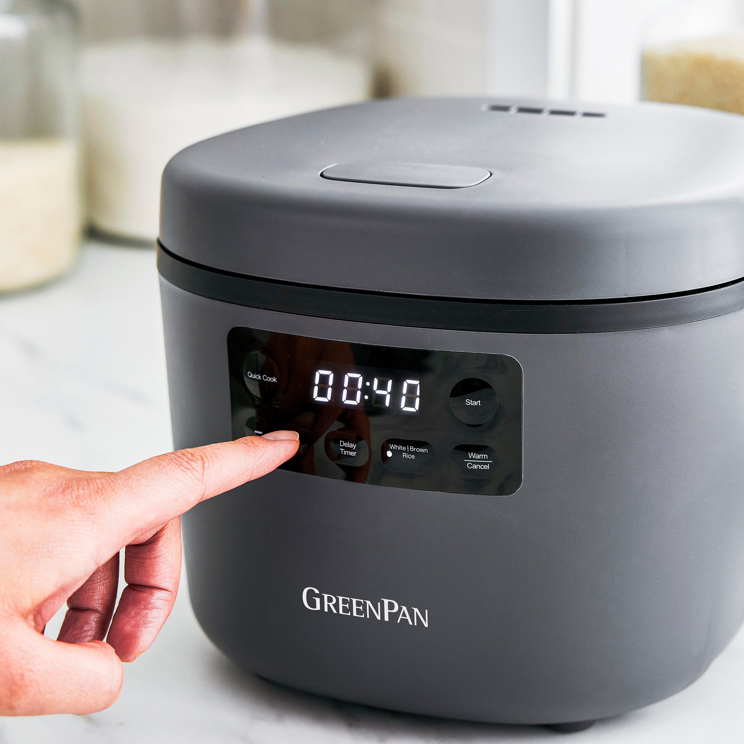Gray GreenPan rice cooker with digital display on a kitchen counter