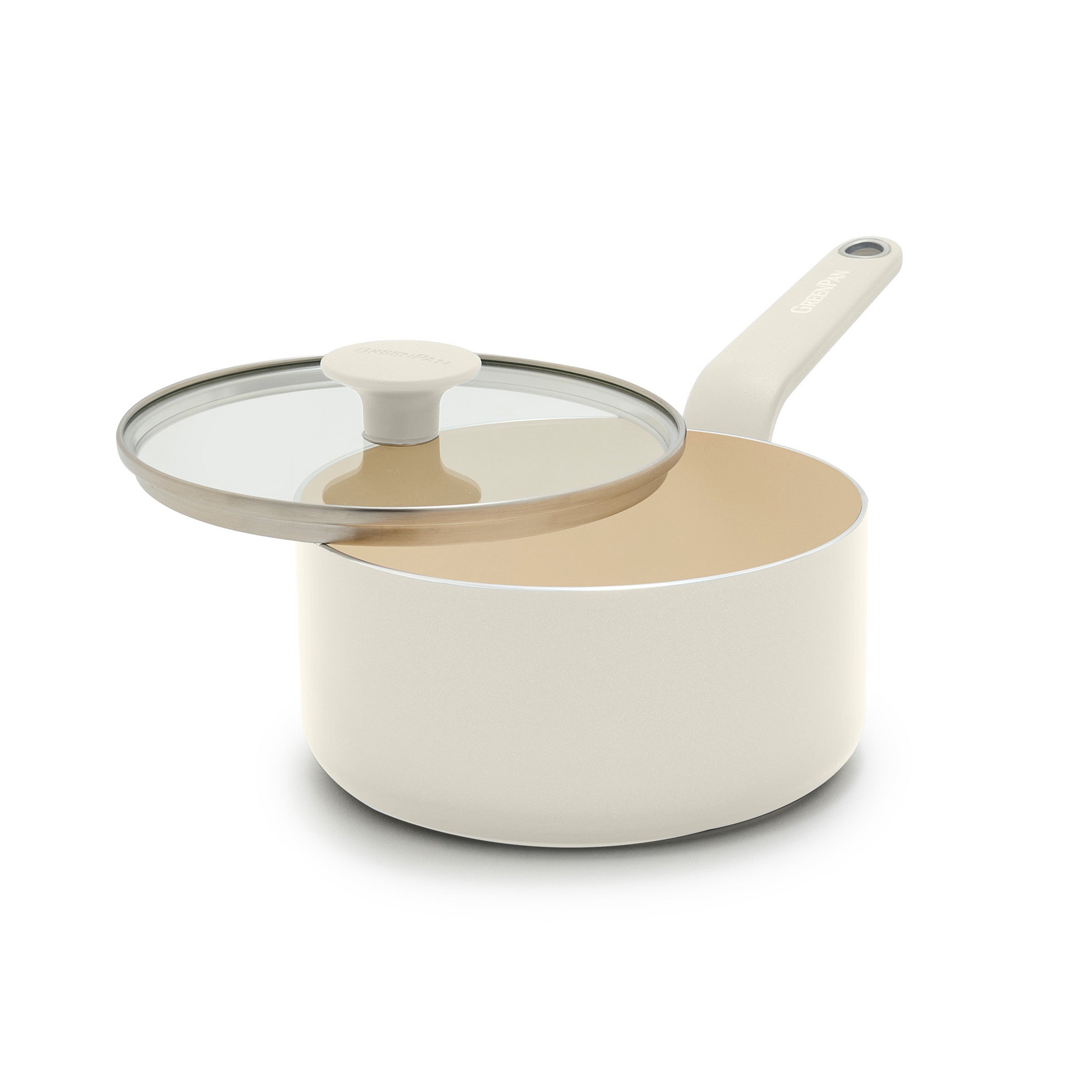 Cream ceramic 2-quart saucepan with long handle and smooth finish, shown with a glass lid slightly ajar.