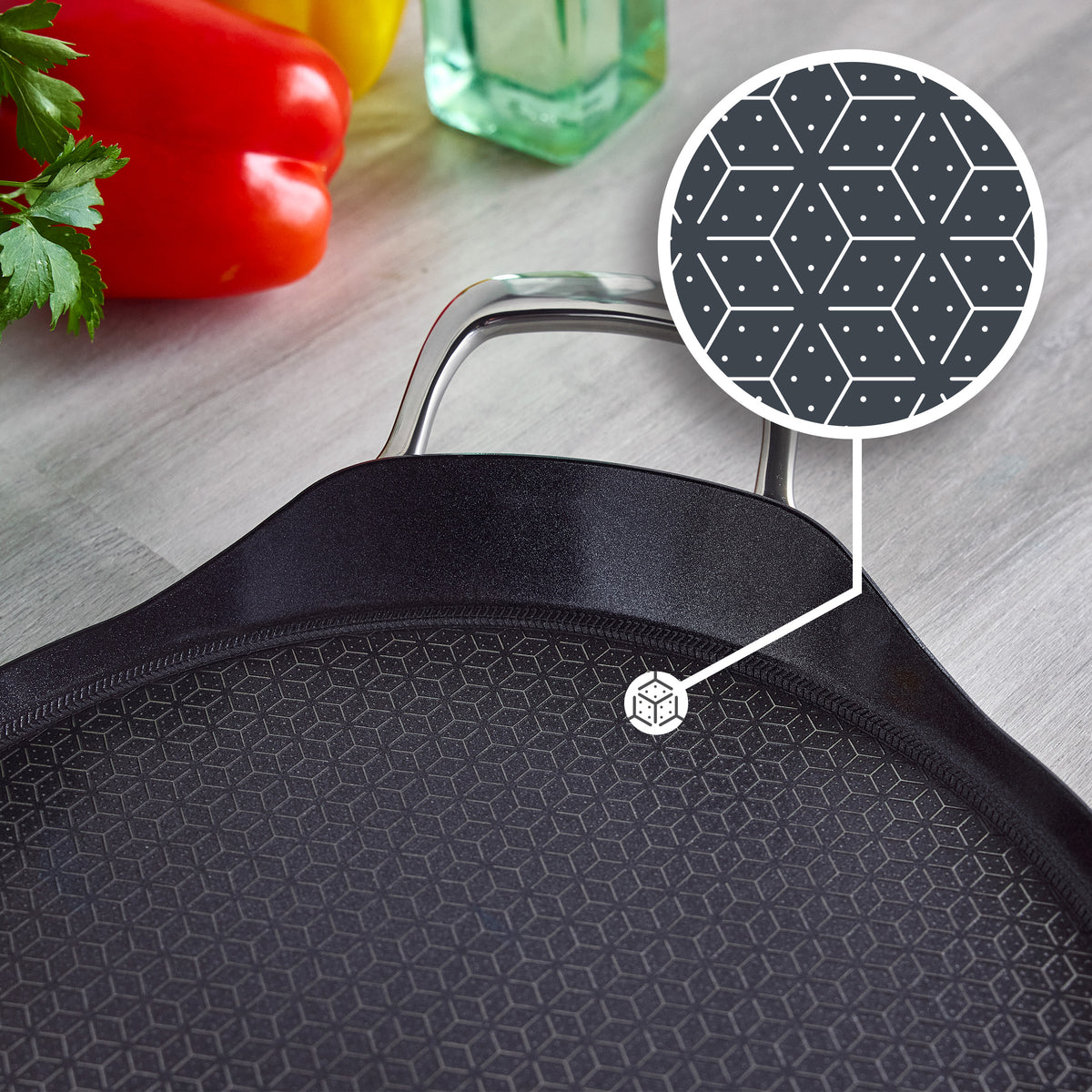 Spectra Thermobond 13-inch round hybrid ceramic griddle featuring a textured stainless steel hexagonal grid pattern.