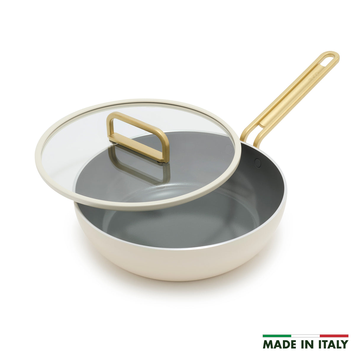 Stanley Tucci 3.25-quart ceramic nonstick Piccolo pan in Carrara White with a grey interior, gold-tone handle, and glass lid.