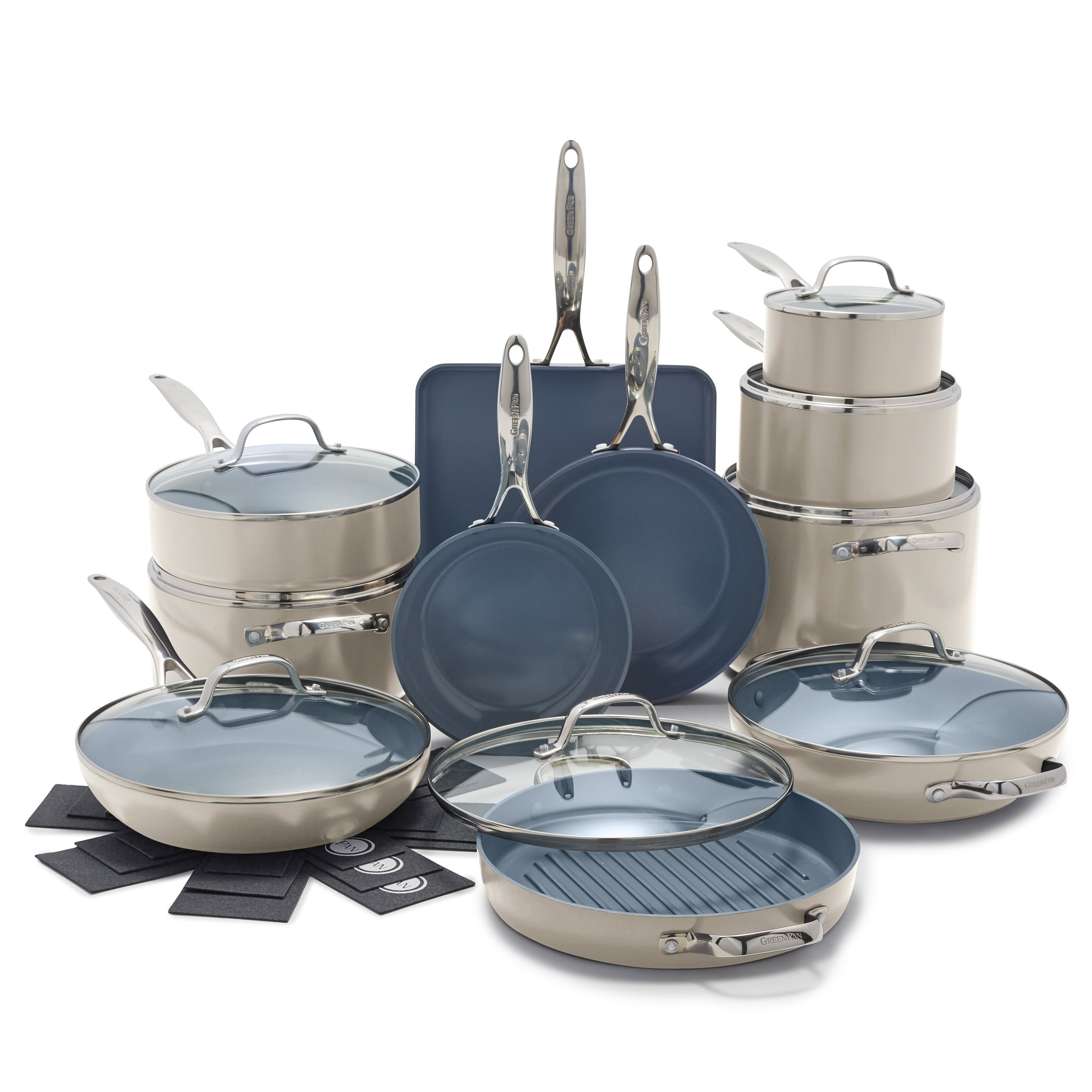 Taupe ceramic cookware set with pots, pans, matching lids, and heat pads; 19 pieces arranged together.