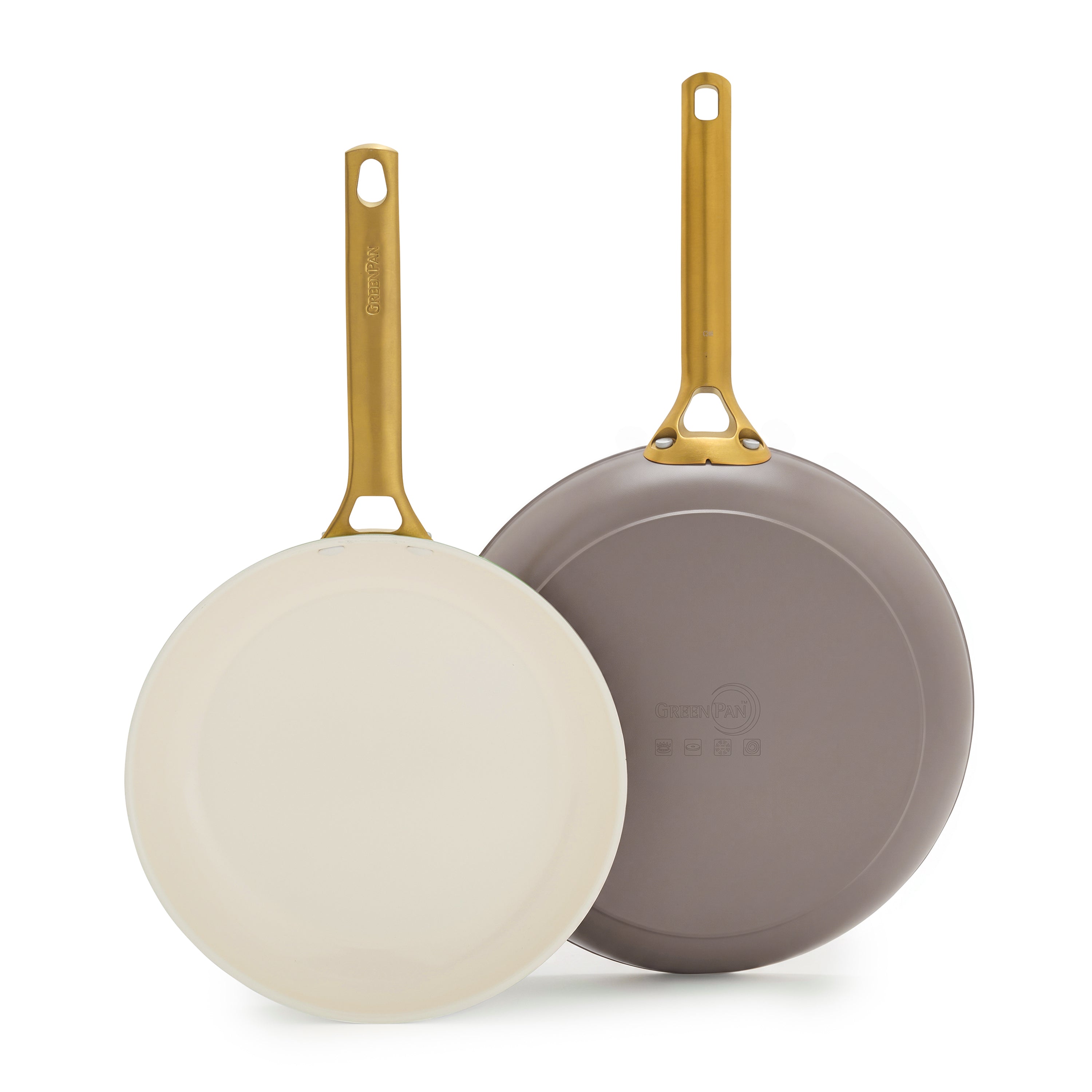 Set of two stackable frypans, 10″ and 12″, in latte with gold handles, cream ceramic interior, gray embossed bottoms.