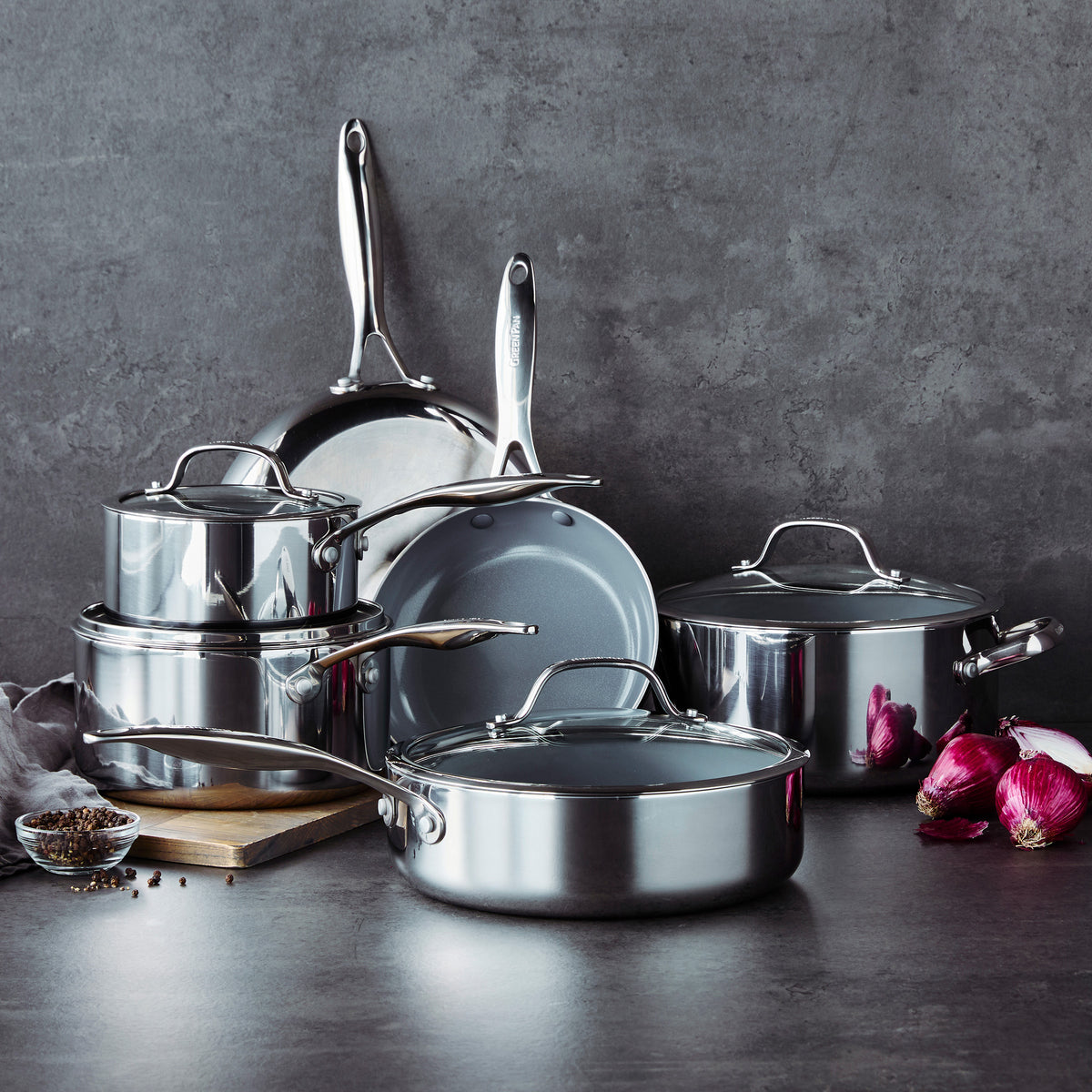 Valencia Pro 18-piece stainless steel cookware set with grey ceramic nonstick interiors and matching lids.