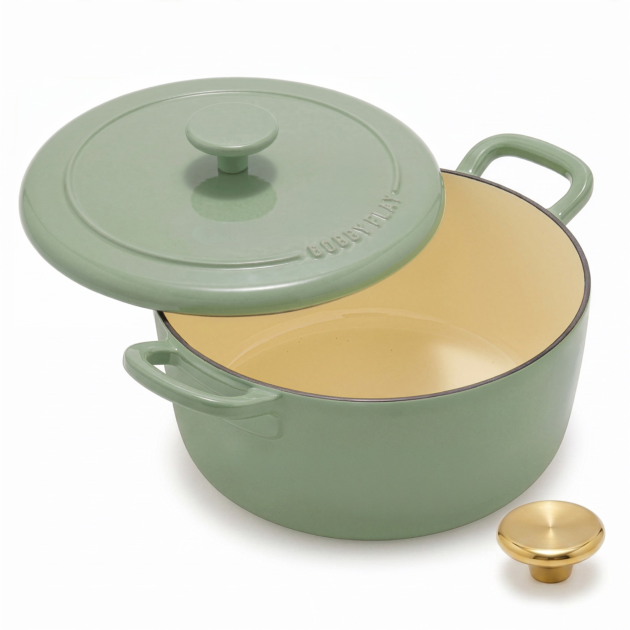 Sage green Dutch oven set with cream interior and gold knob, includes 3 pieces.
