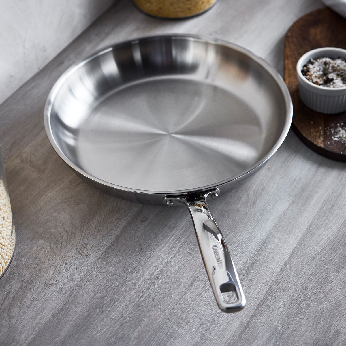 Chatham Pro 12-inch stainless steel uncoated frypan on a wooden countertop.