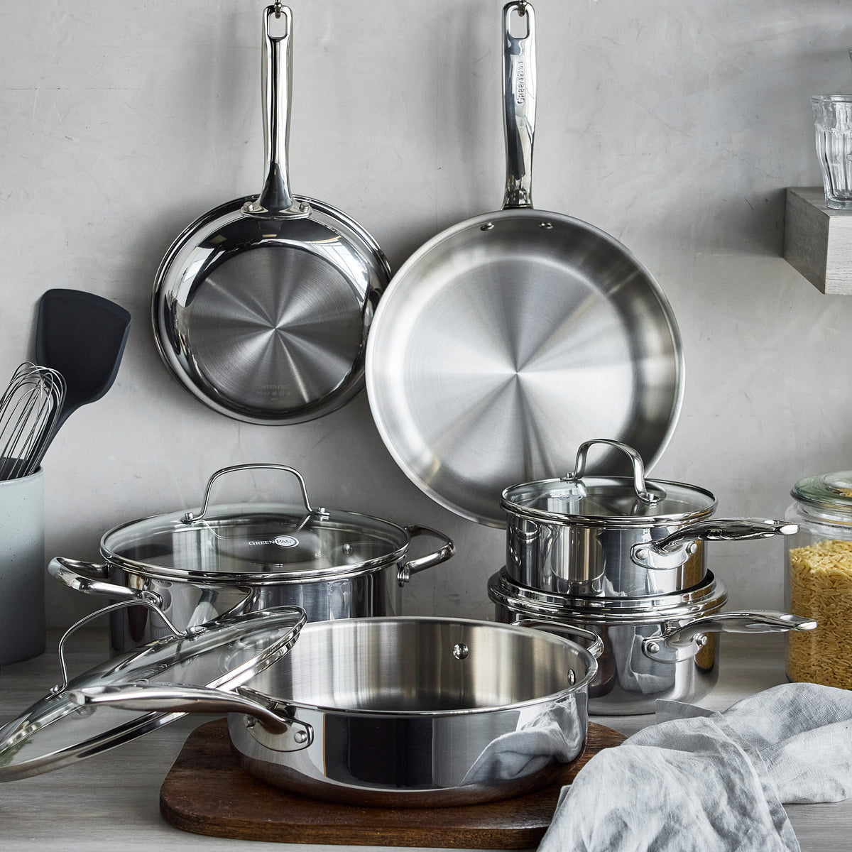 Chatham Pro 12-piece stainless steel uncoated cookware set with glass lids on a kitchen counter.