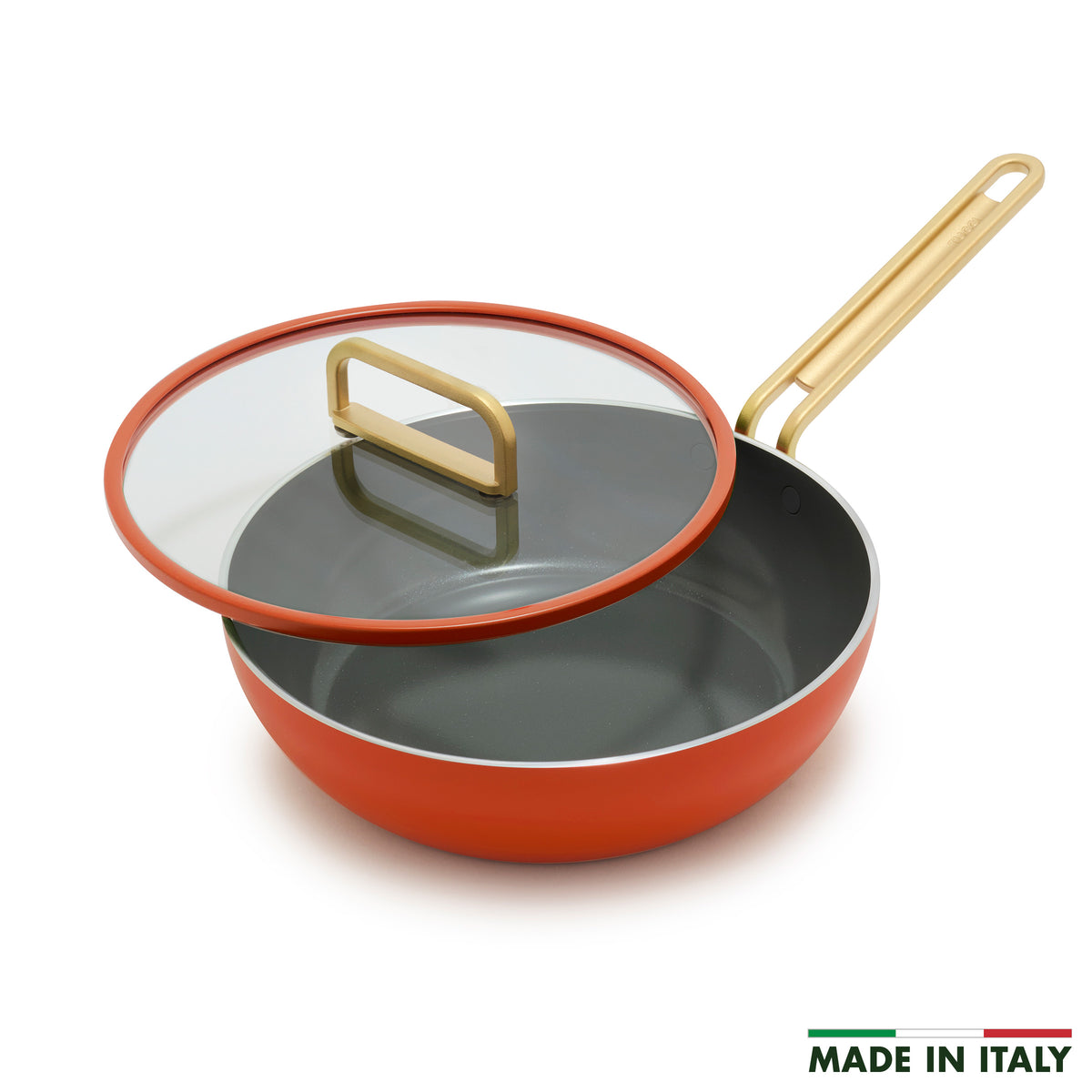 Stanley Tucci 3.25-quart ceramic nonstick Piccolo pan in Amalfi Sunset with a gold-tone handle and glass lid with an orange rim.