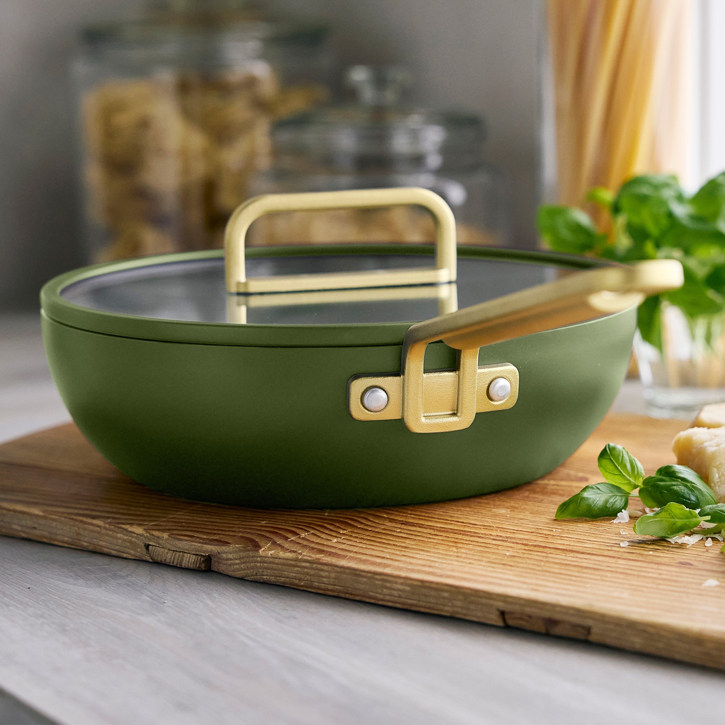 Ceramic nonstick 3.25-qt pan in Tuscan olive green with a matching lid and gold handle, single piece shown.