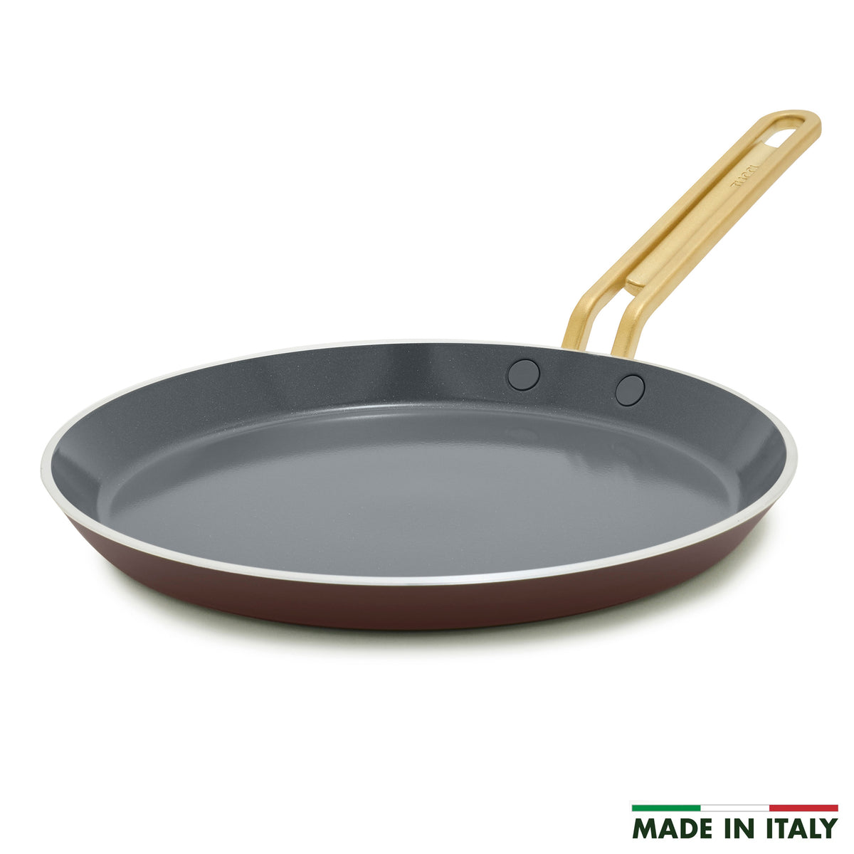 Stanley Tucci 10-inch espresso ceramic crepe and omelette pan with a shallow rim and gold-tone handle.