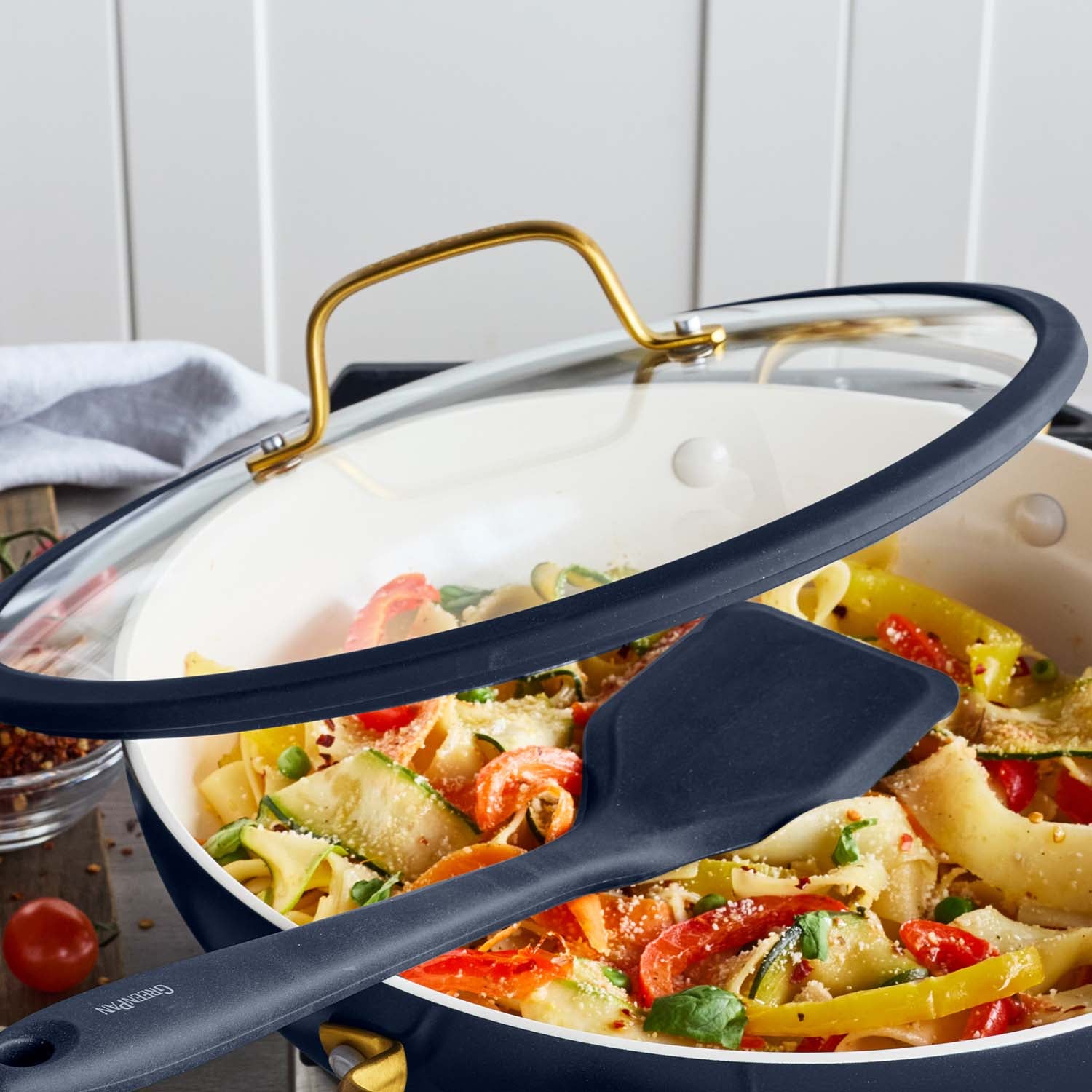 Ceramic nonstick everyday pan with lid in twilight blue, 3.75-quart size.